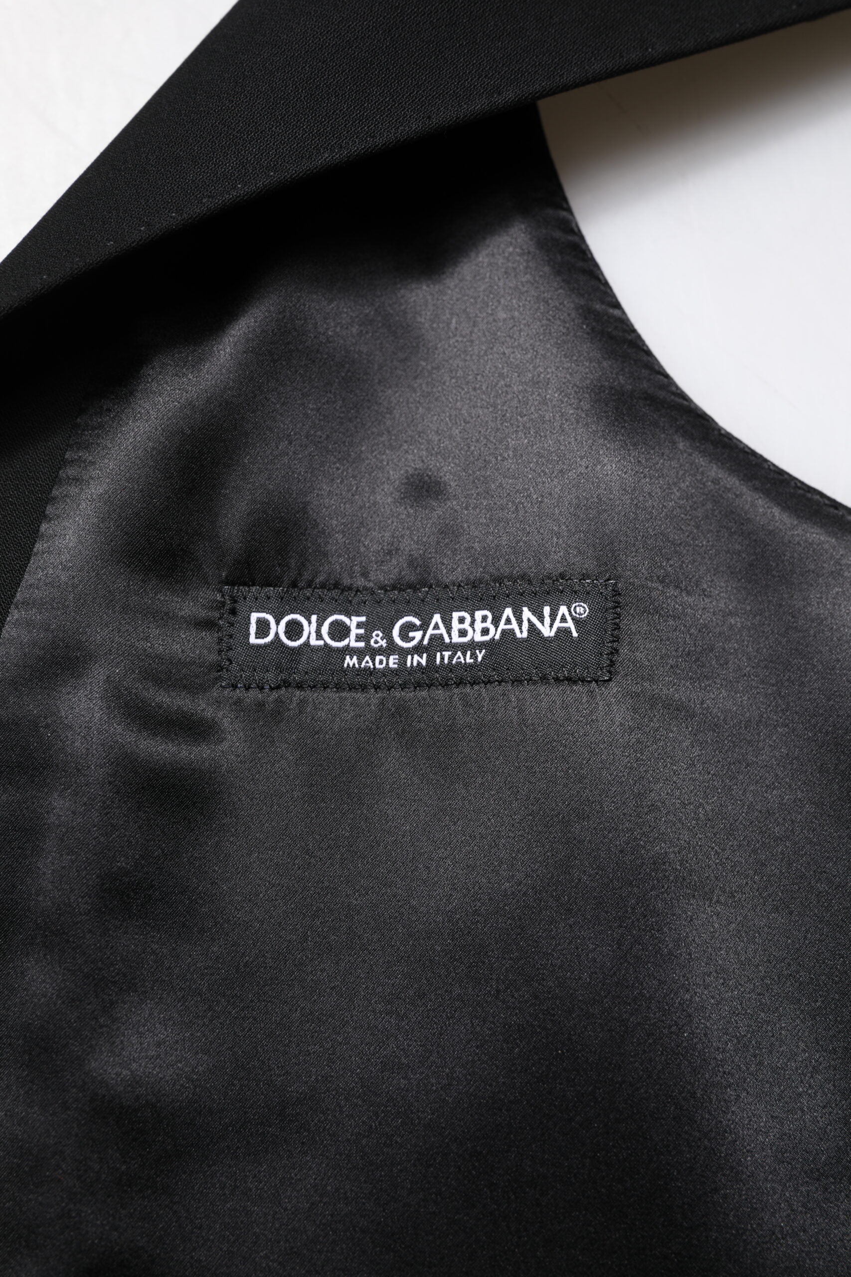 A black wool waistcoat with the Dolce & Gabbana logo