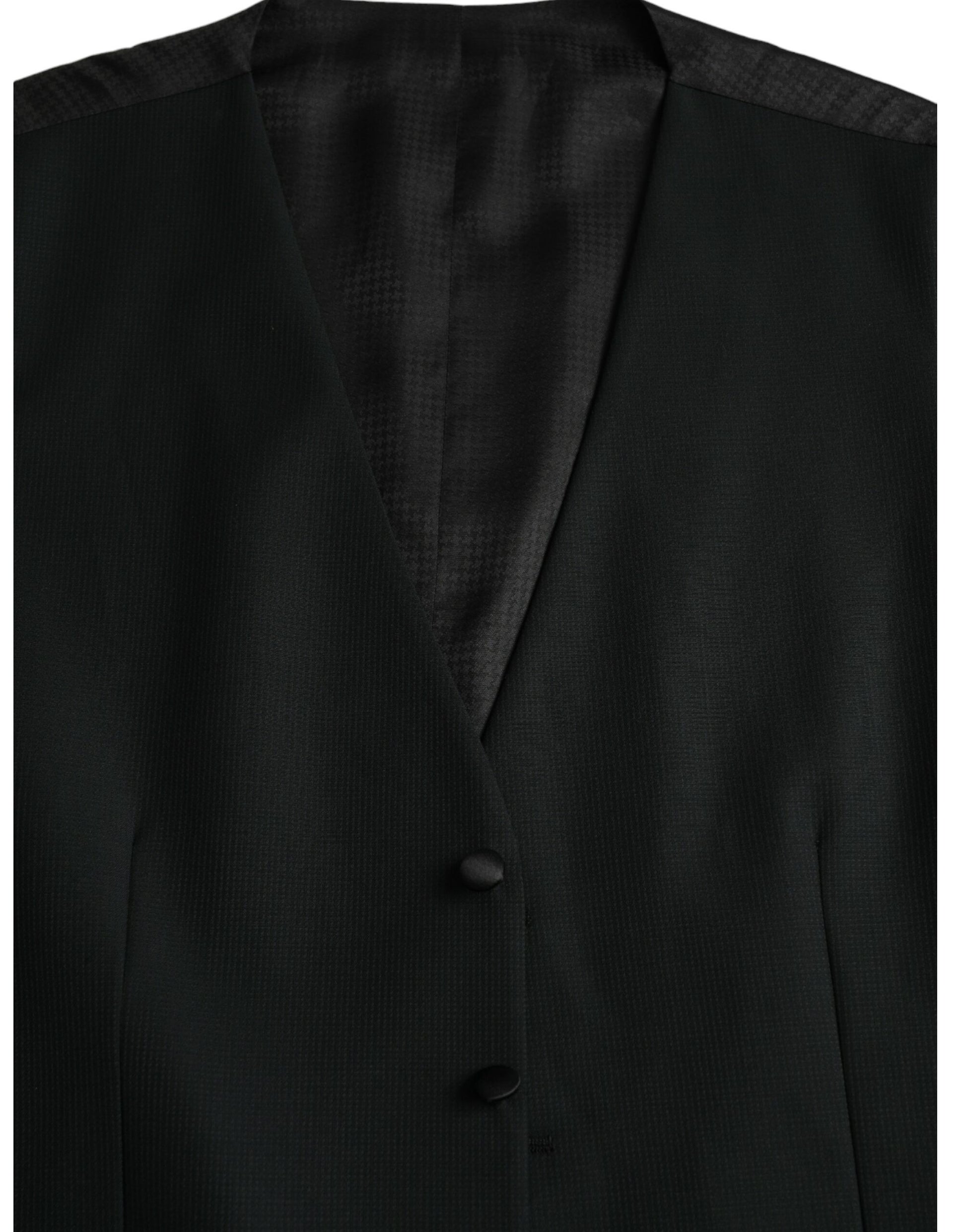 A black wool waistcoat with a textured pattern, featuring two buttons on the front