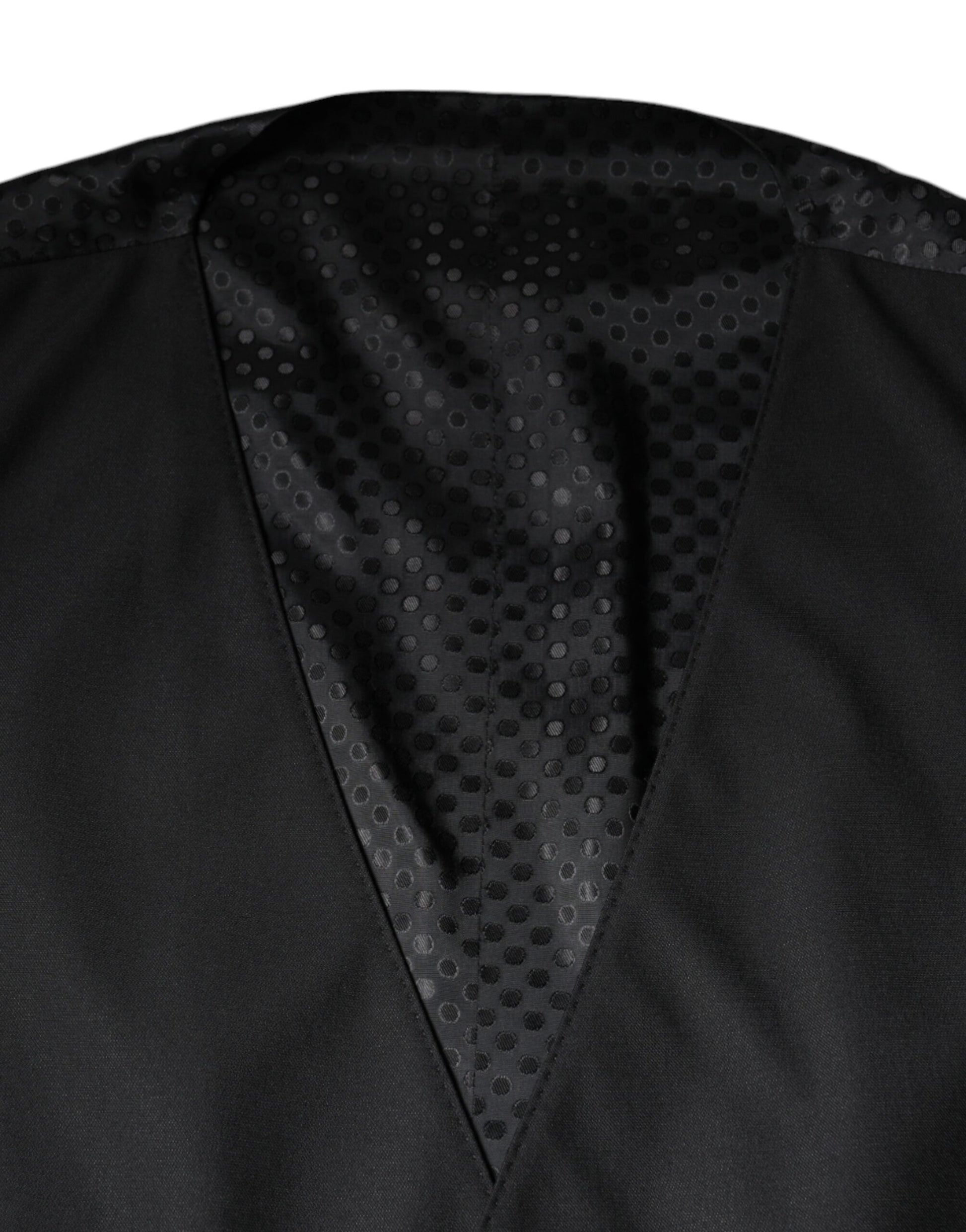 A black wool waistcoat with a textured pattern, part of a formal dress suit
