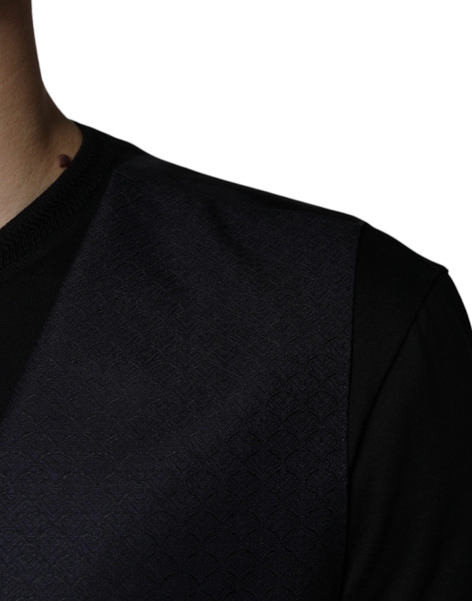 A black wool waistcoat with a textured pattern, part of a formal dress vest