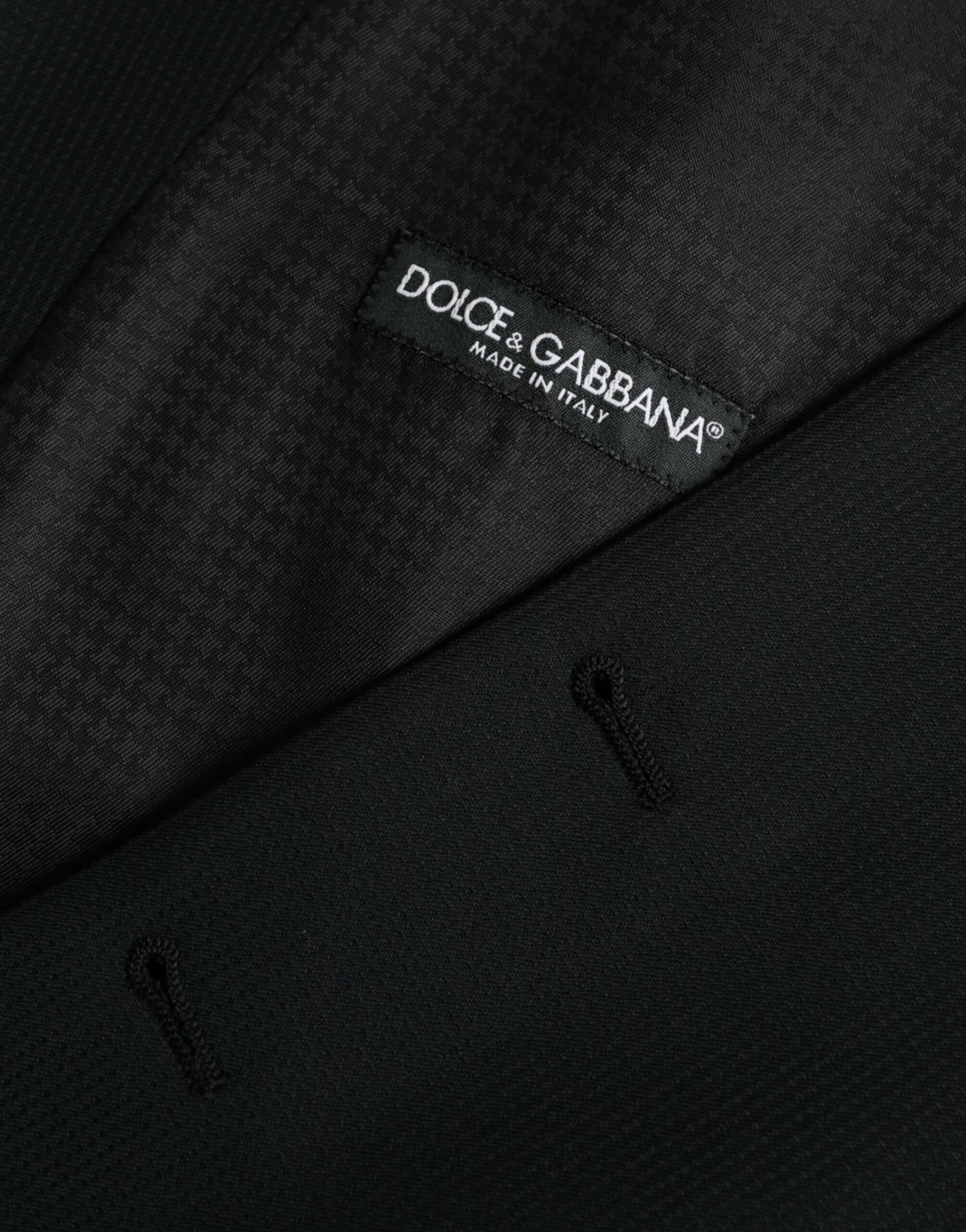A black wool waistcoat with a label that reads "Dolce & Gabbana" on the left chest area