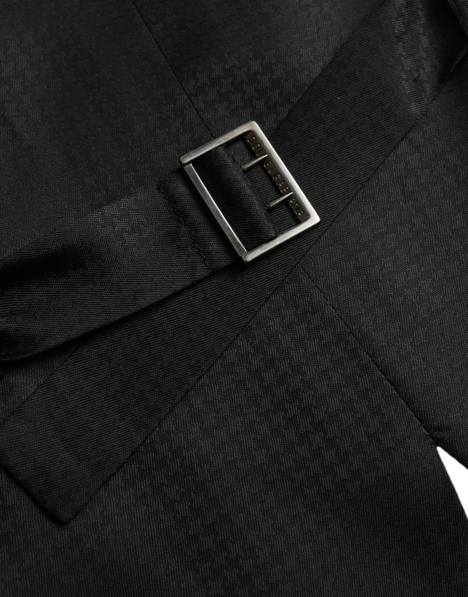 A black wool waistcoat with a silver buckle
