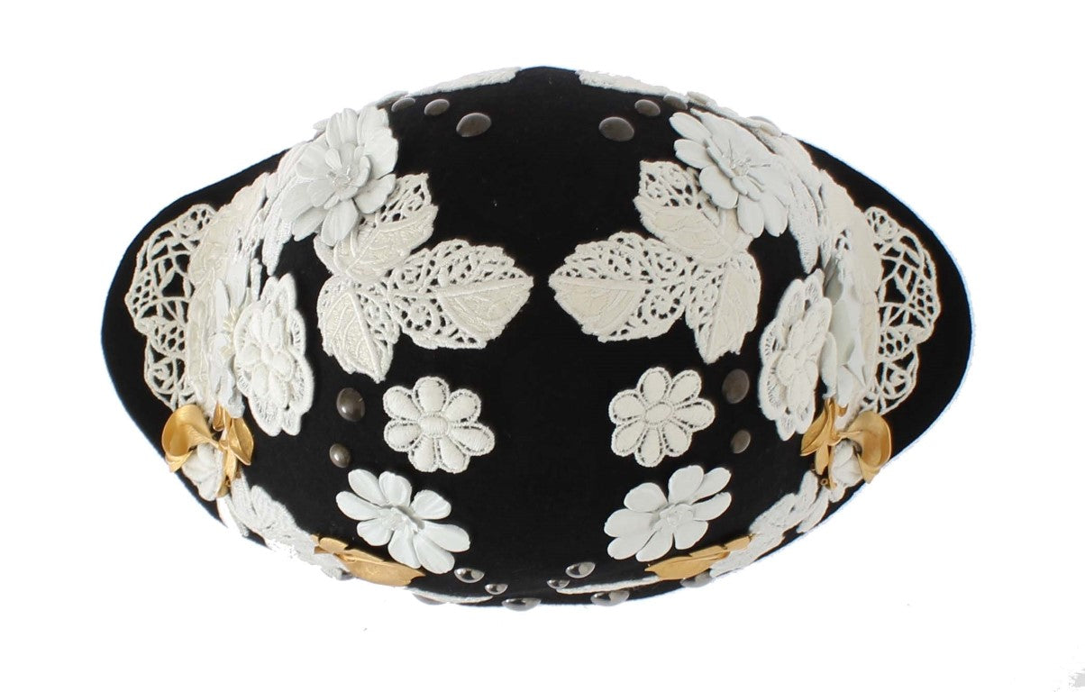 Decorative black hat with white lace flowers and gold accents