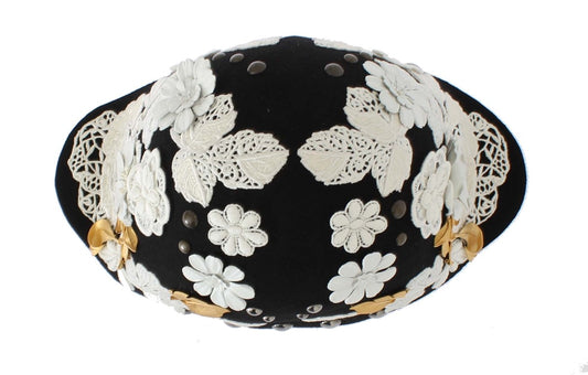 Decorative black hat with white lace flowers and gold accents