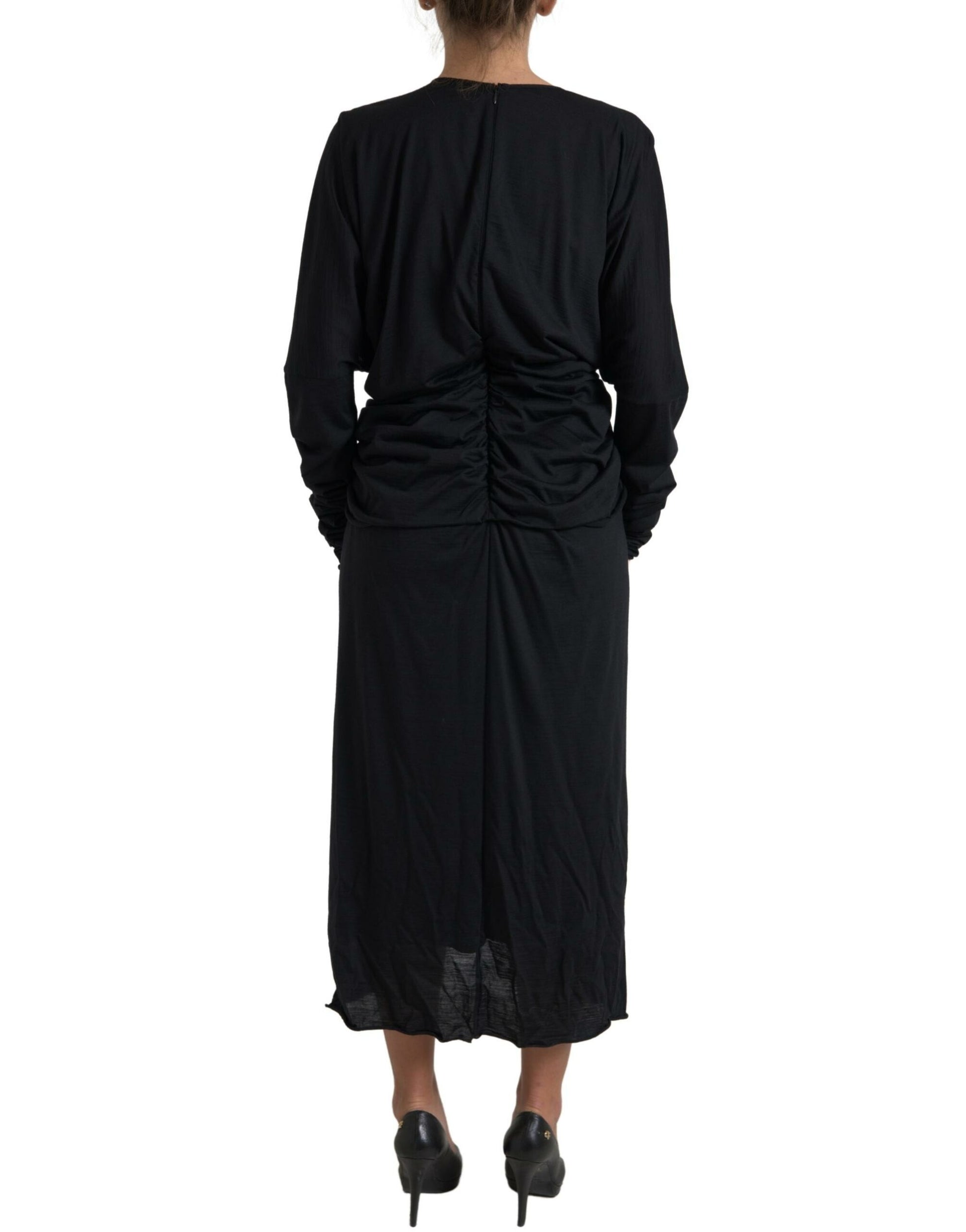 A black midi dress with a wrap style and wool fabric