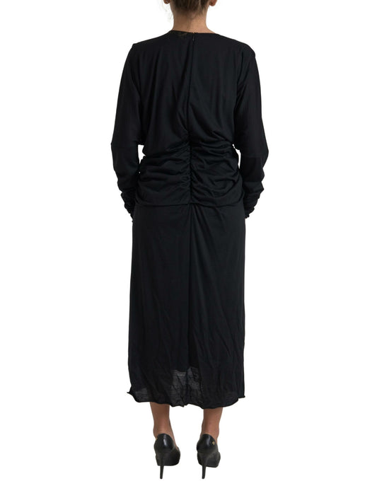 A black midi dress with a wrap style and wool fabric