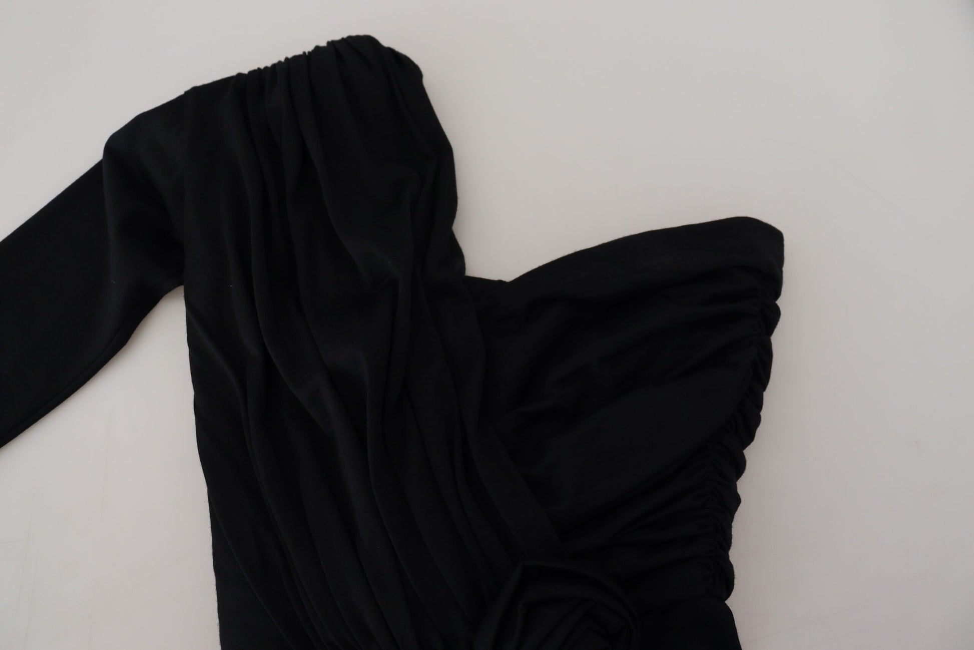 Black garment on white surface