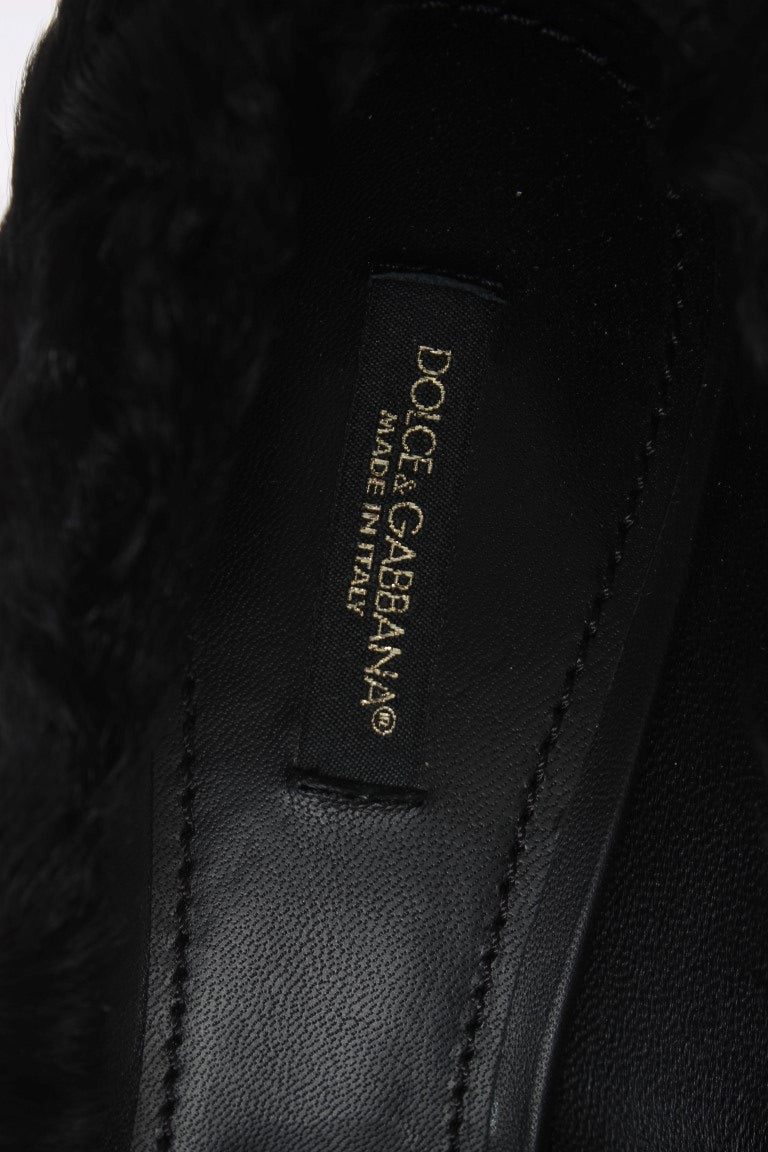 Black leather shoe with gold label reading DOLCE & GABBANA