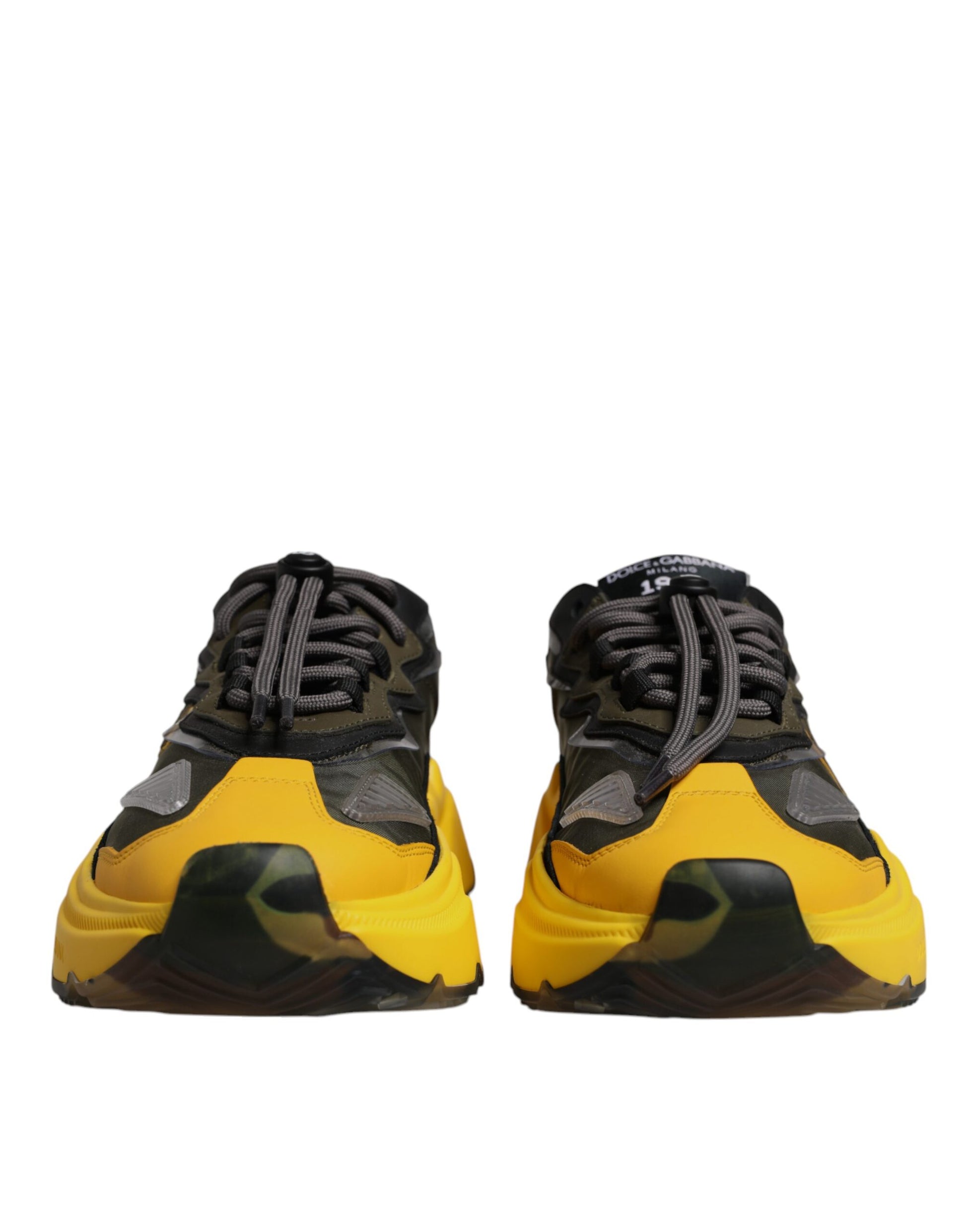 Pair of yellow and black sneakers with laces, designed by Dolce & Gabbana