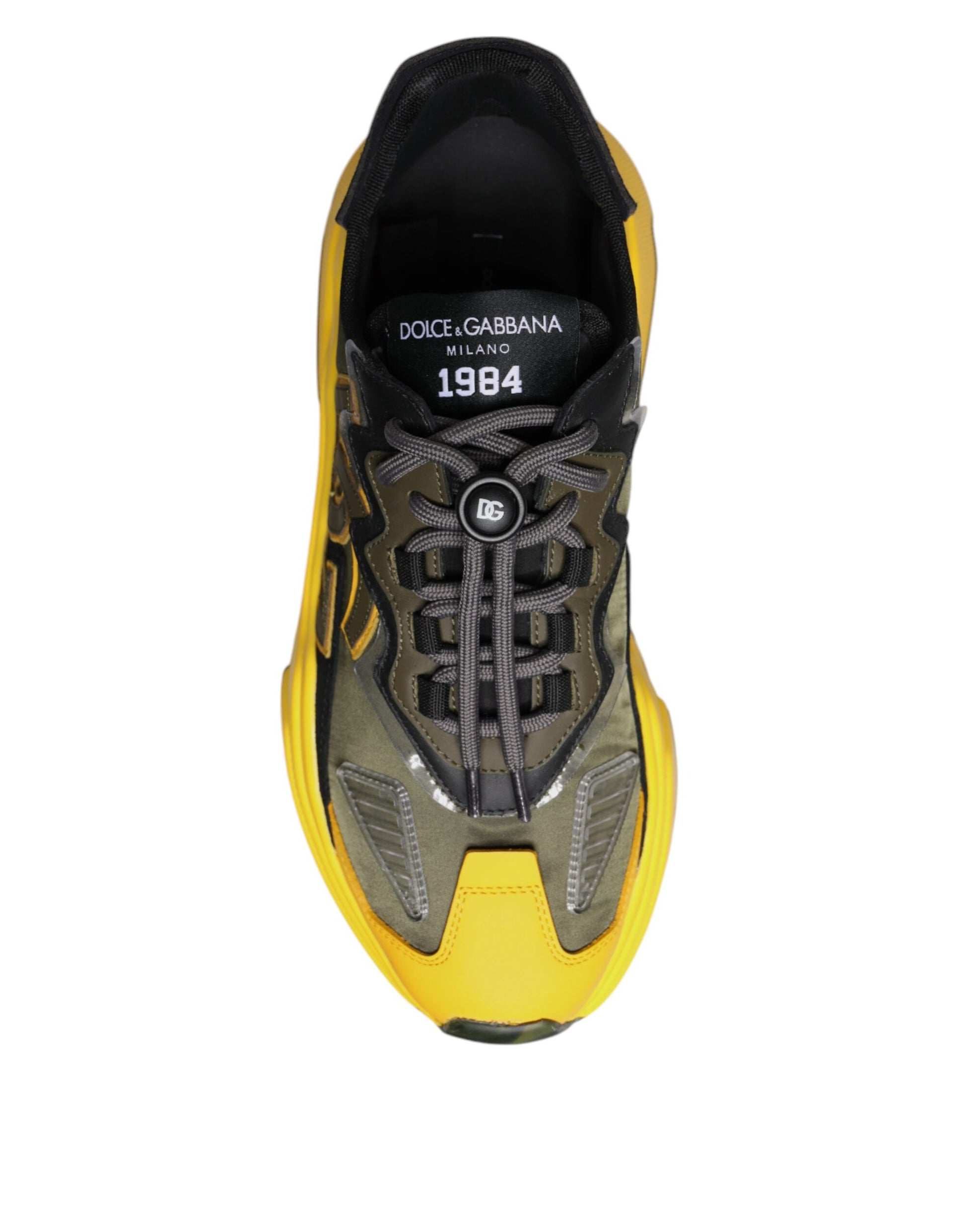 A pair of black and yellow sneakers with a low top, featuring the Dolce & Gabbana logo