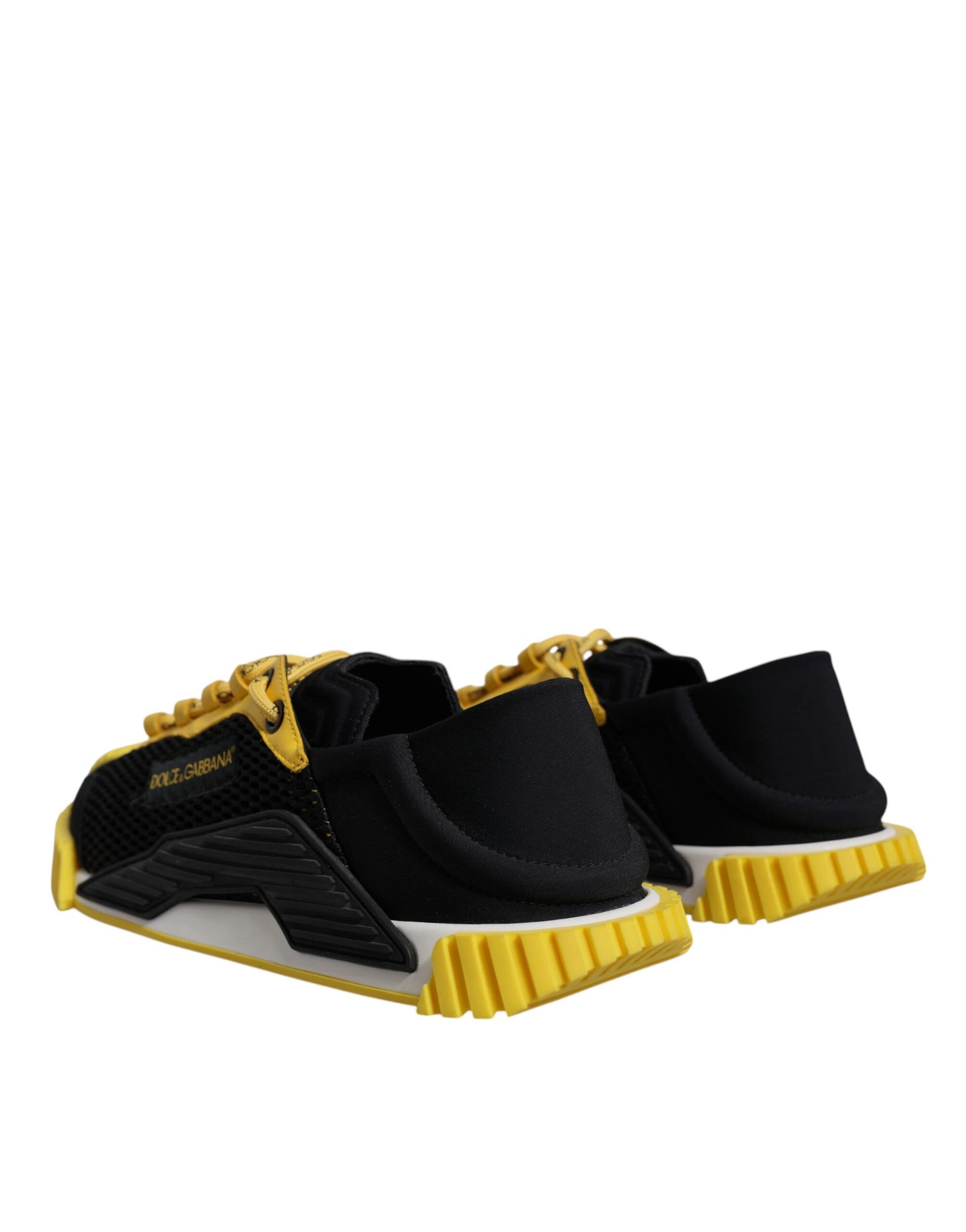 Pair of black and yellow athletic shoes with white soles
