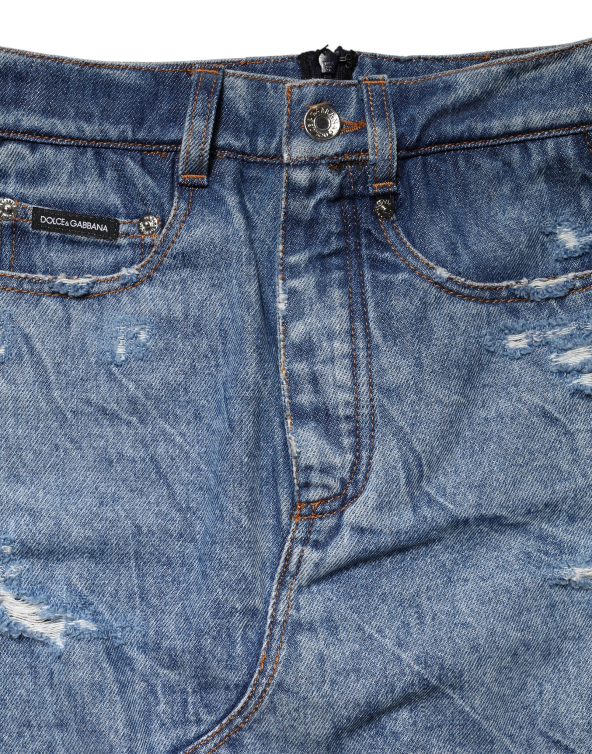 Blue denim jeans with faded areas and distressed design