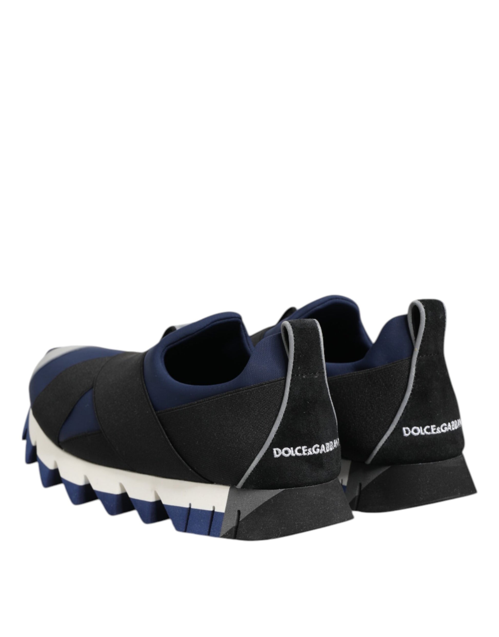 Pair of blue black slip on low top men's shoes with white sole