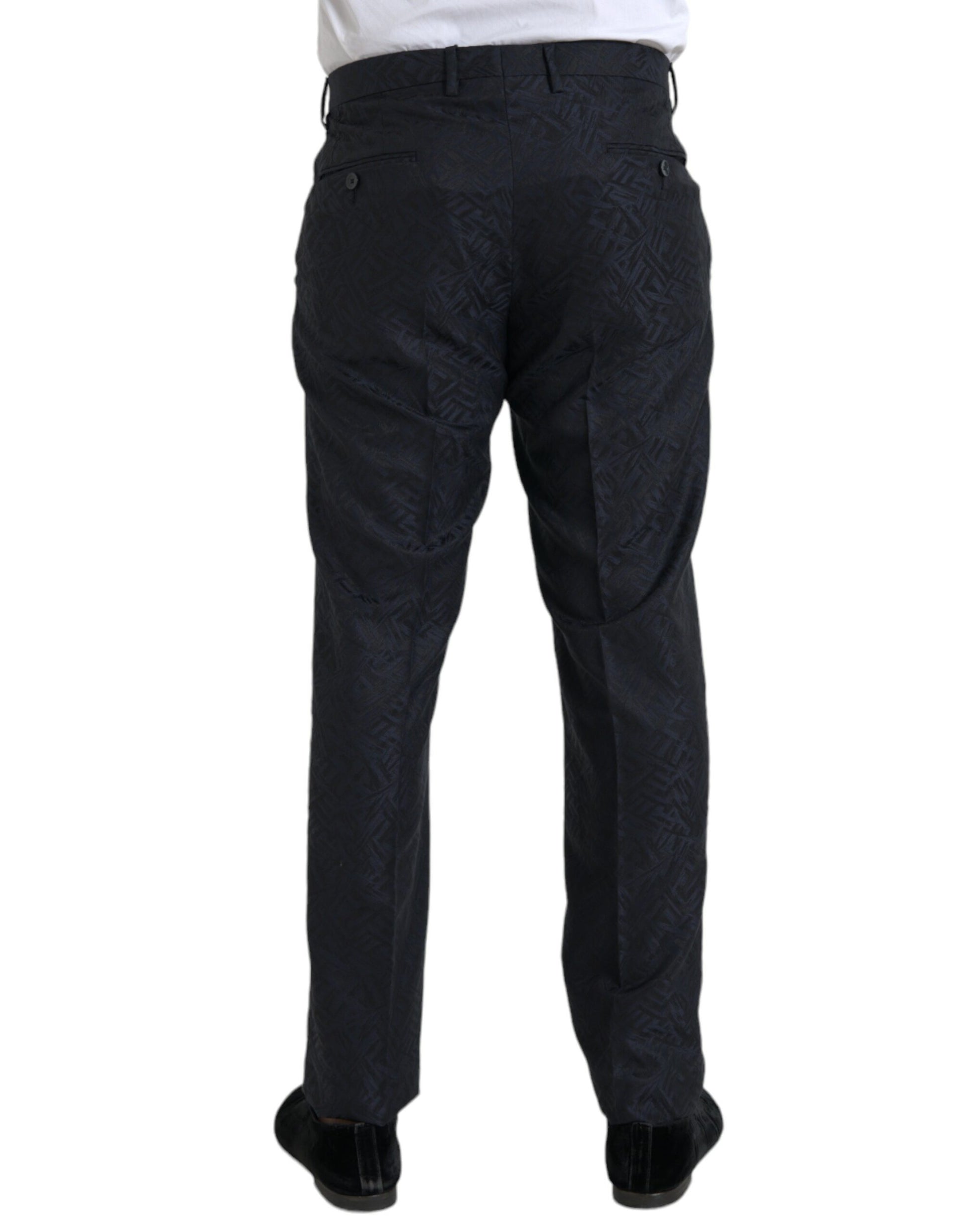 A pair of men's dress pants with a blue brocade wool pattern. They are designed by Dolce & Gabbana and have a