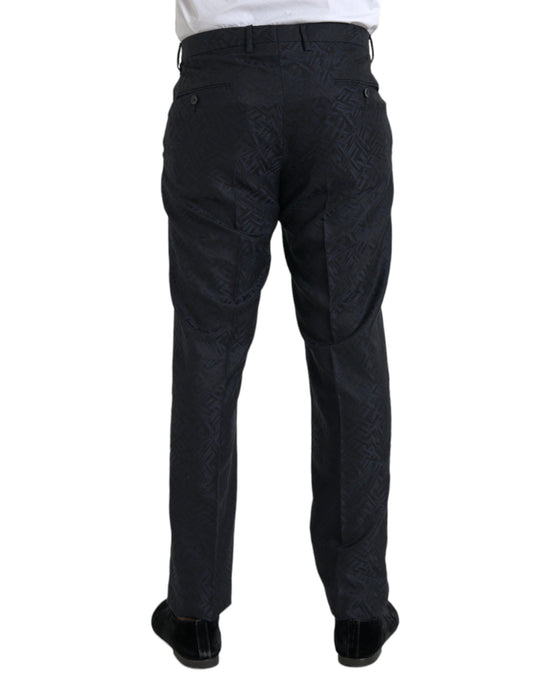 A pair of men's dress pants with a blue brocade wool pattern. They are designed by Dolce & Gabbana and have a
