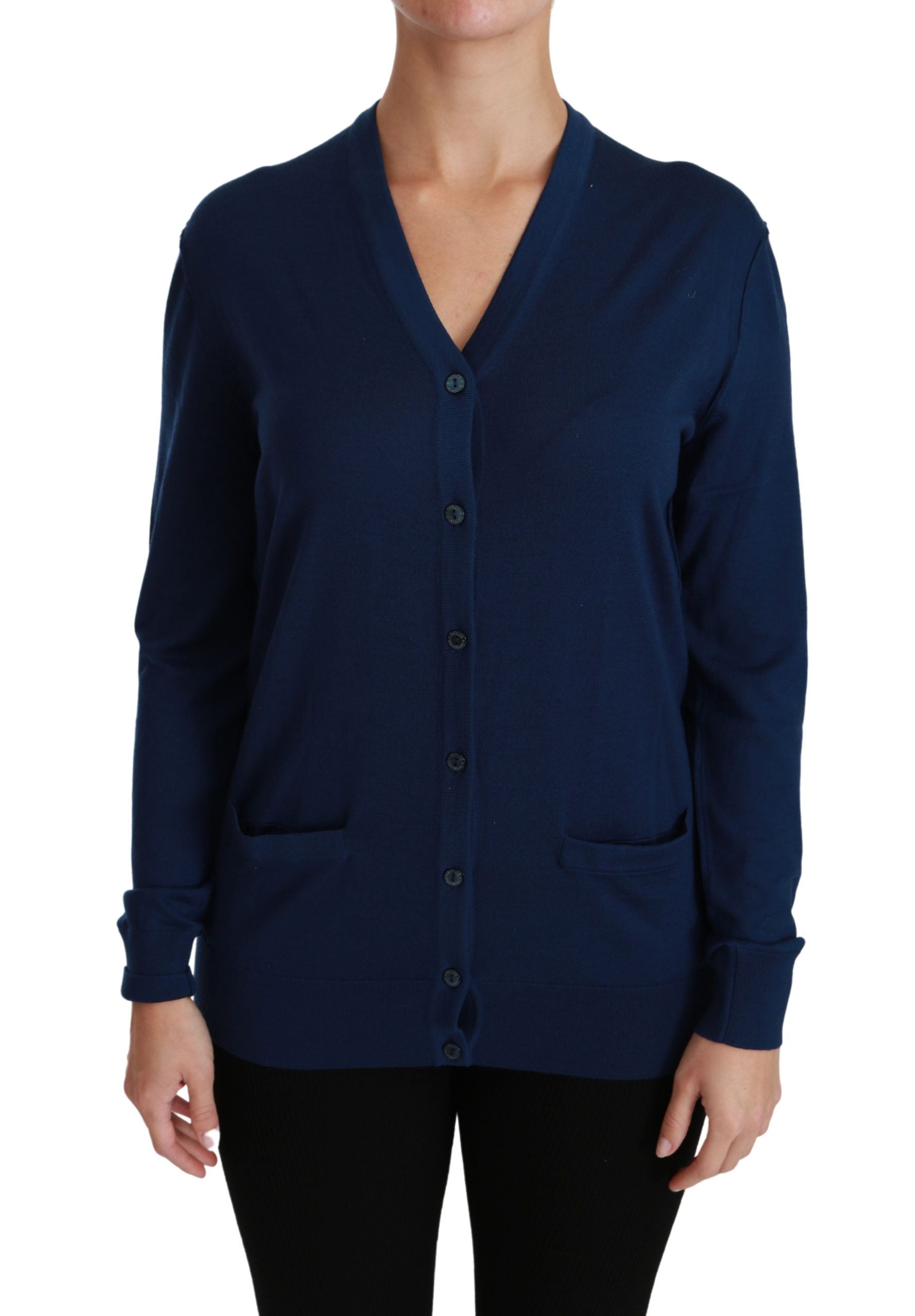 Woman wearing blue cardigan with buttons down front