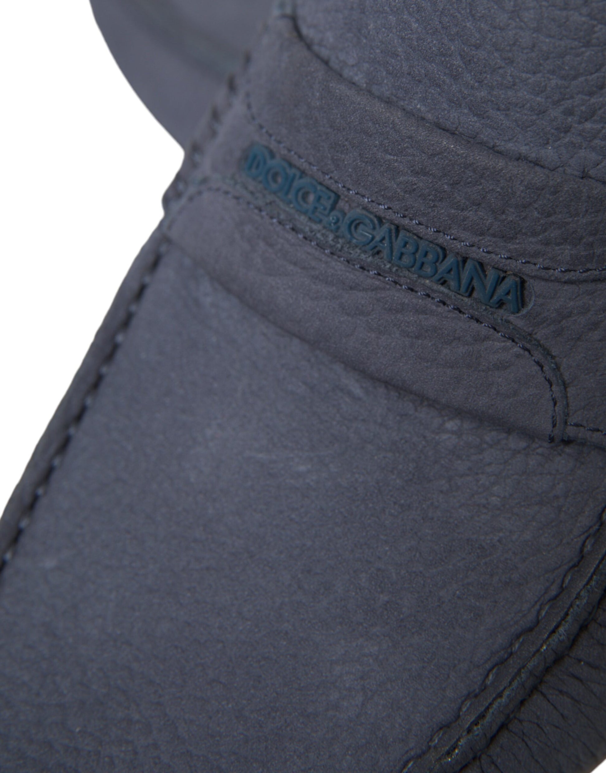 The visible part of a shoe with a black leather upper