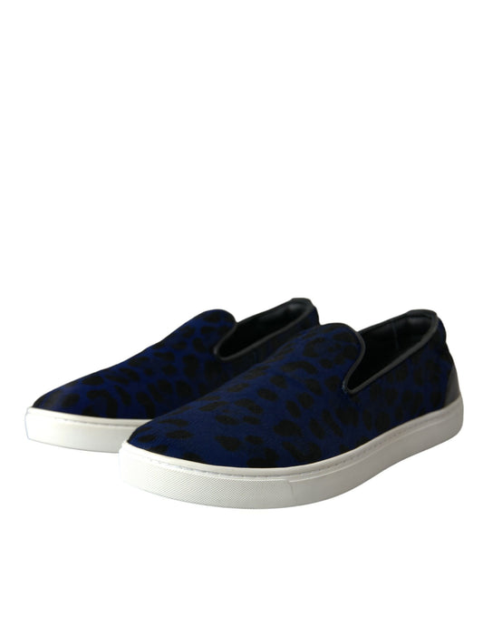 Pair of blue and white slip-on shoes with a leopard print pattern on the upper part