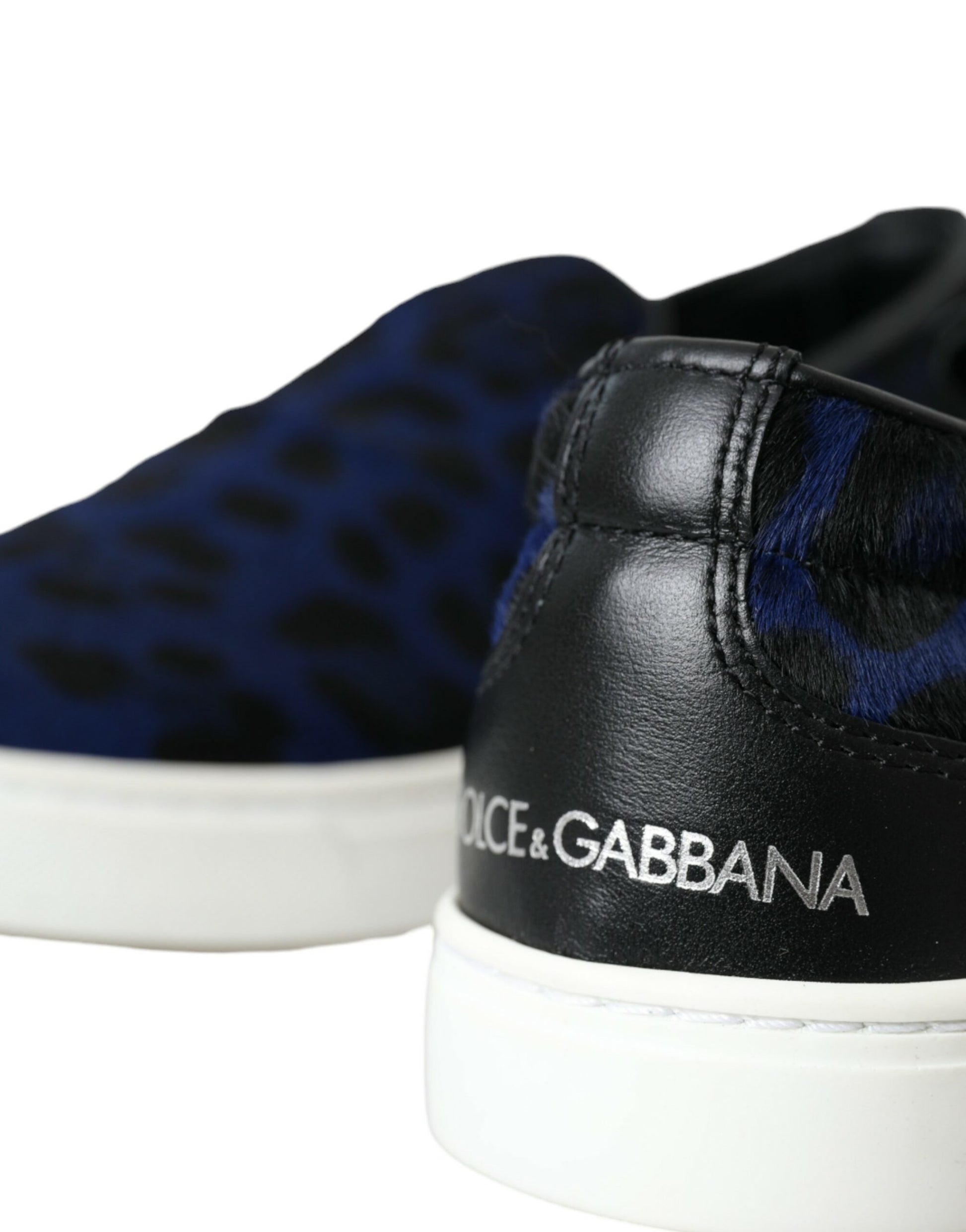 Pair of sneakers with animal print design and brand name on side
