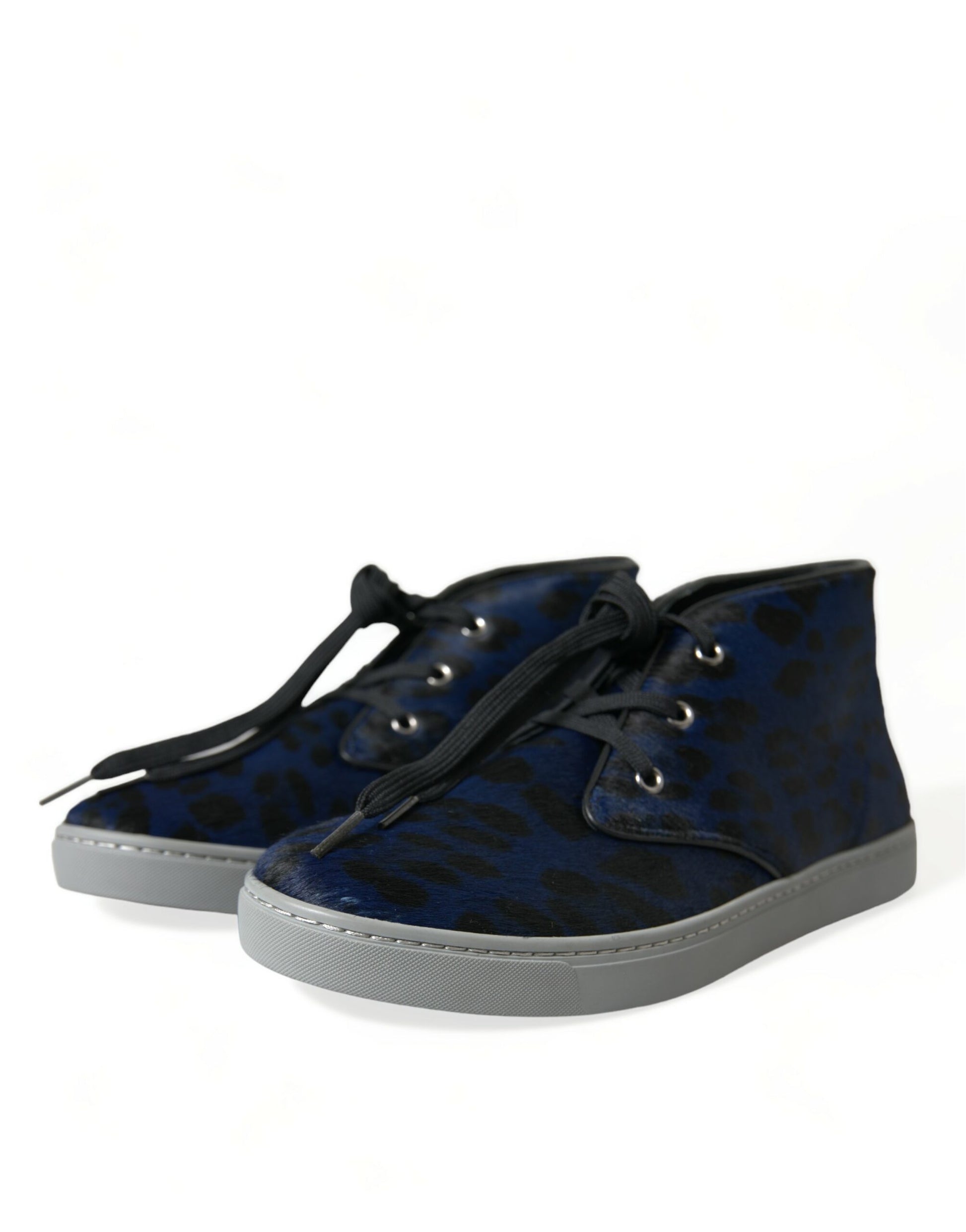 Pair of blue suede boots with white soles and laces