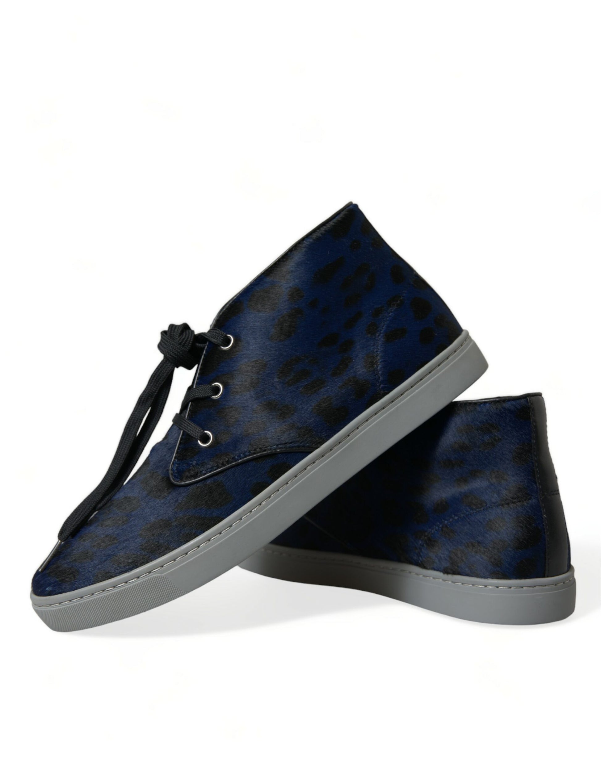 Pair of blue suede shoes with white soles and laces
