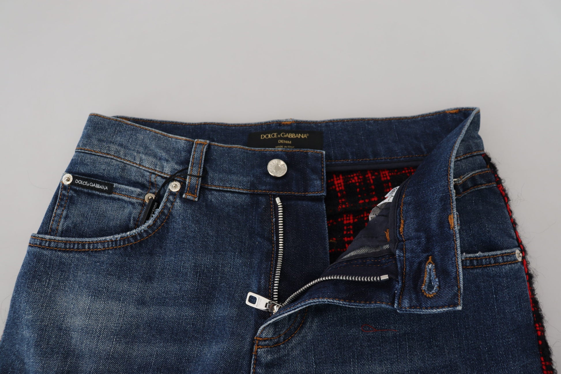 Pair of blue jeans with zipper fly and button closure