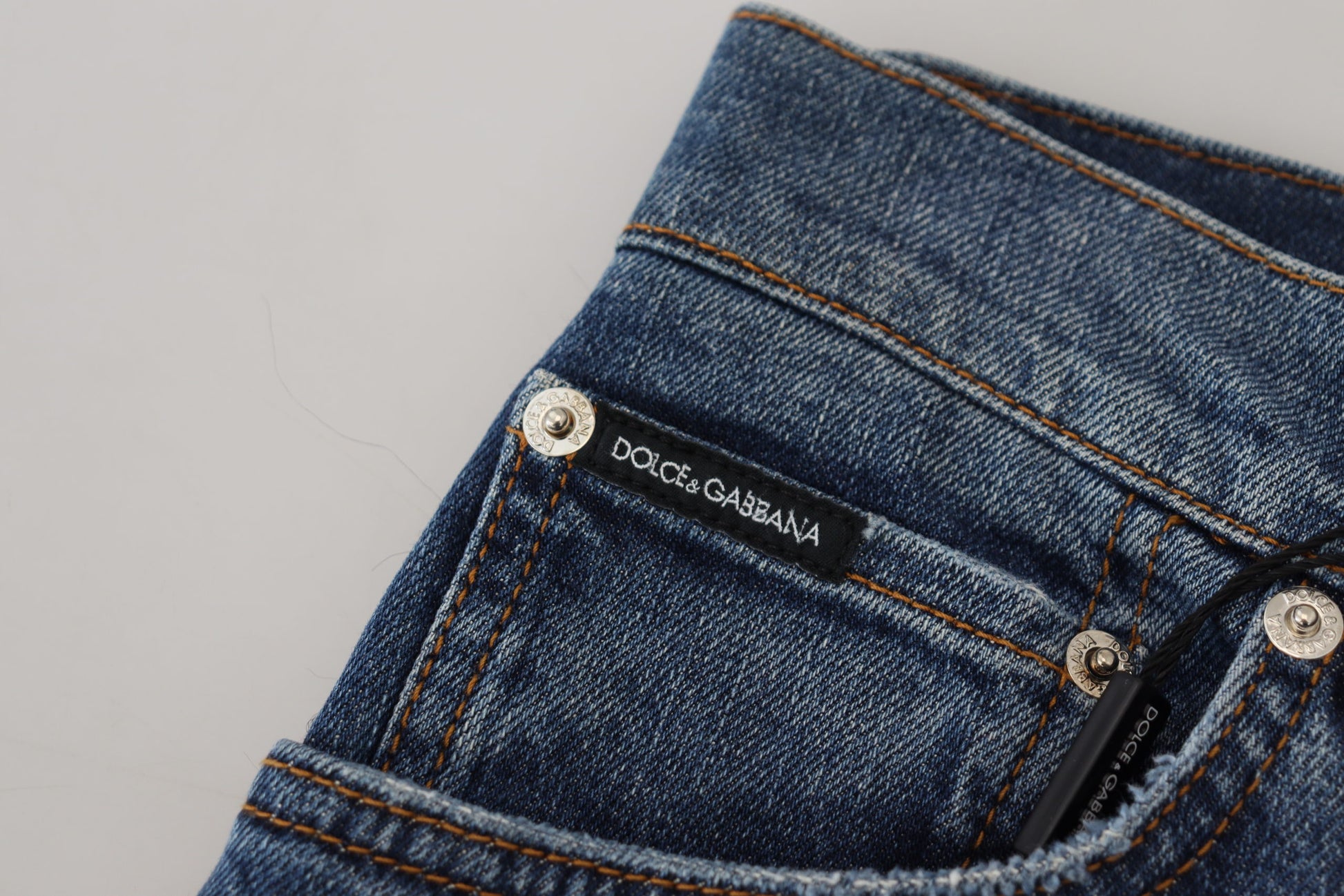 Blue denim jeans with brand label on waistband