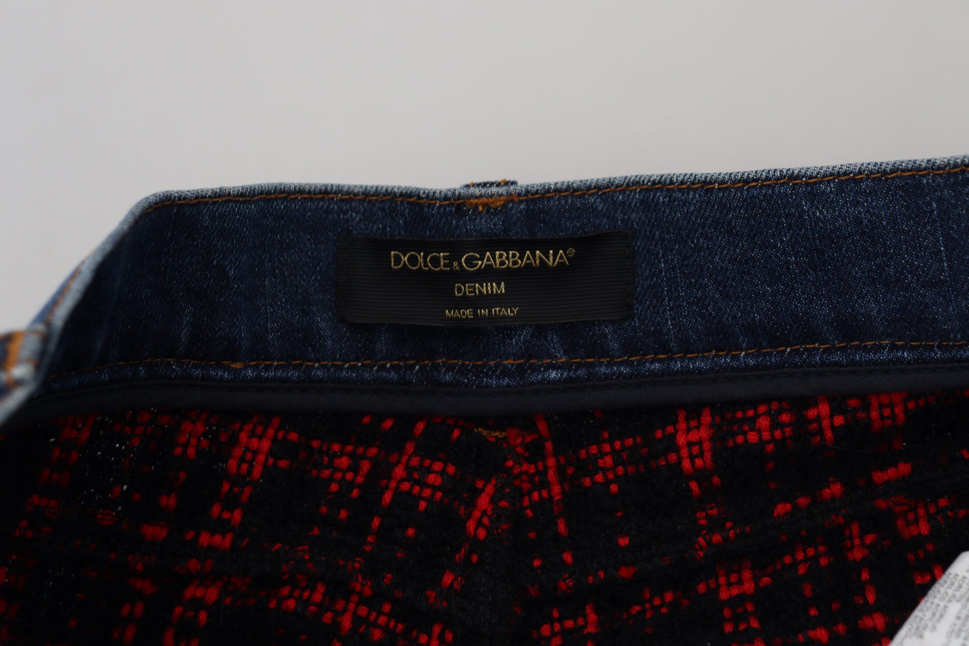 Blue denim jeans with red plaid lining