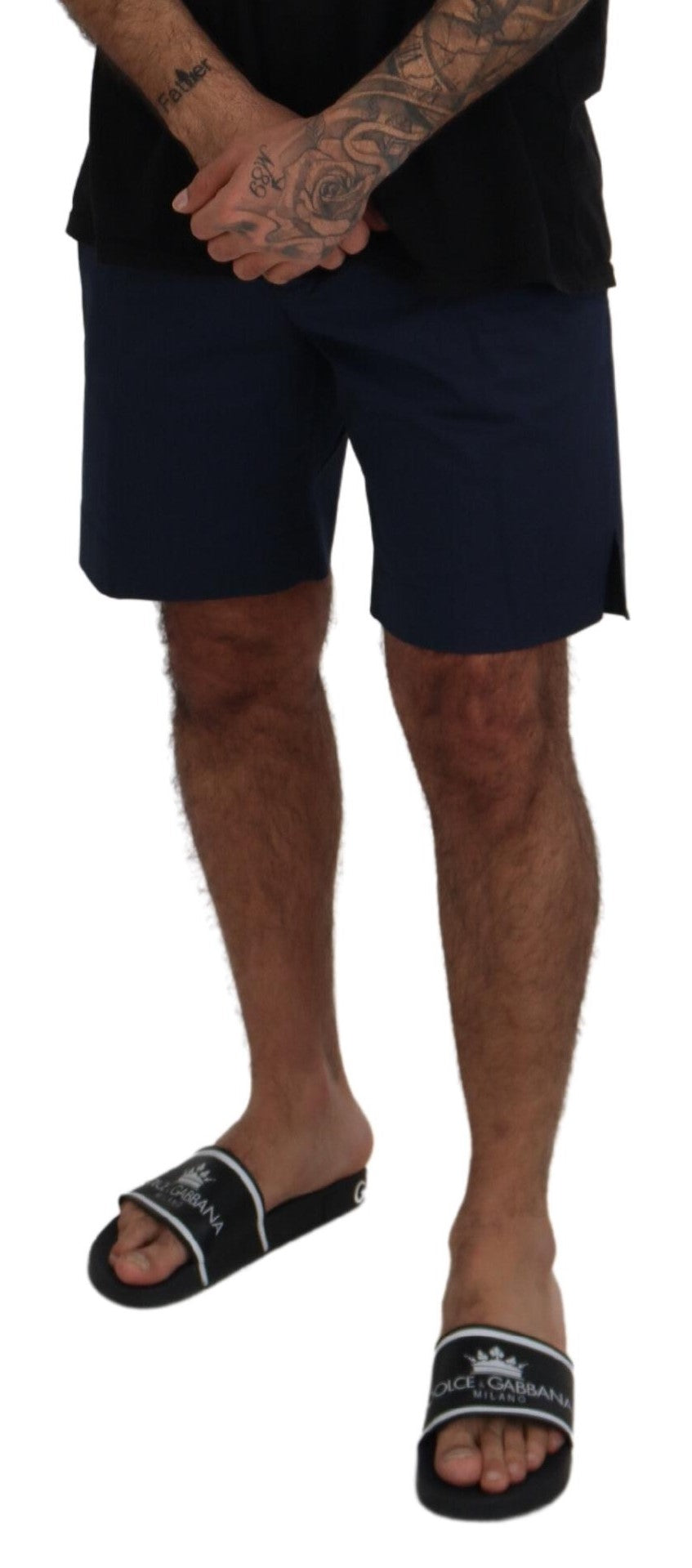 Man wearing black shorts and flip flops