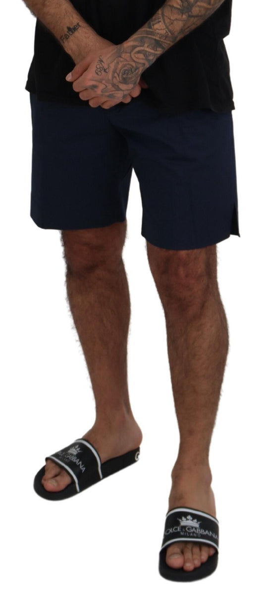 Man wearing black shorts and flip flops
