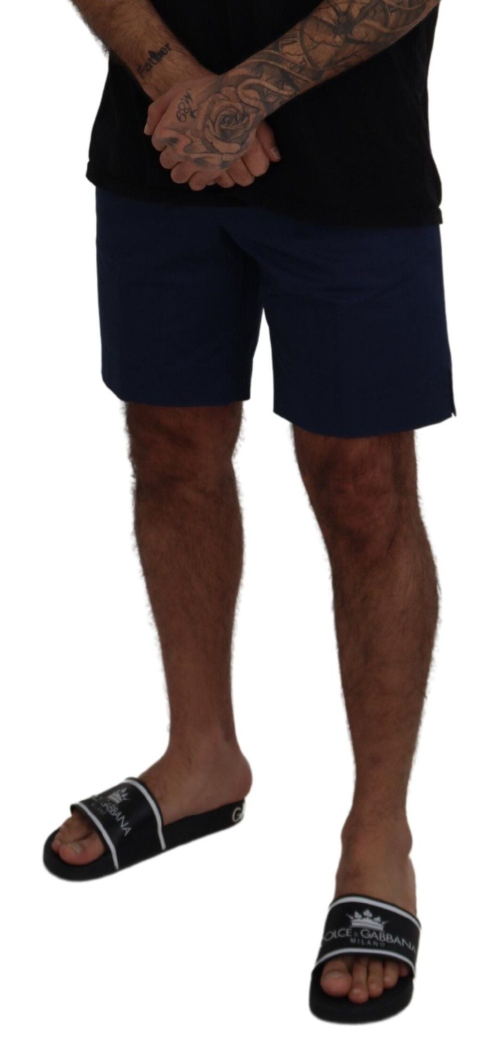 Man wearing black shorts and flip flops