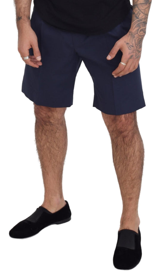 A pair of blue chinos with a stretchy cotton fabric, designed by Dolce & Gabbana. They are casual shorts that