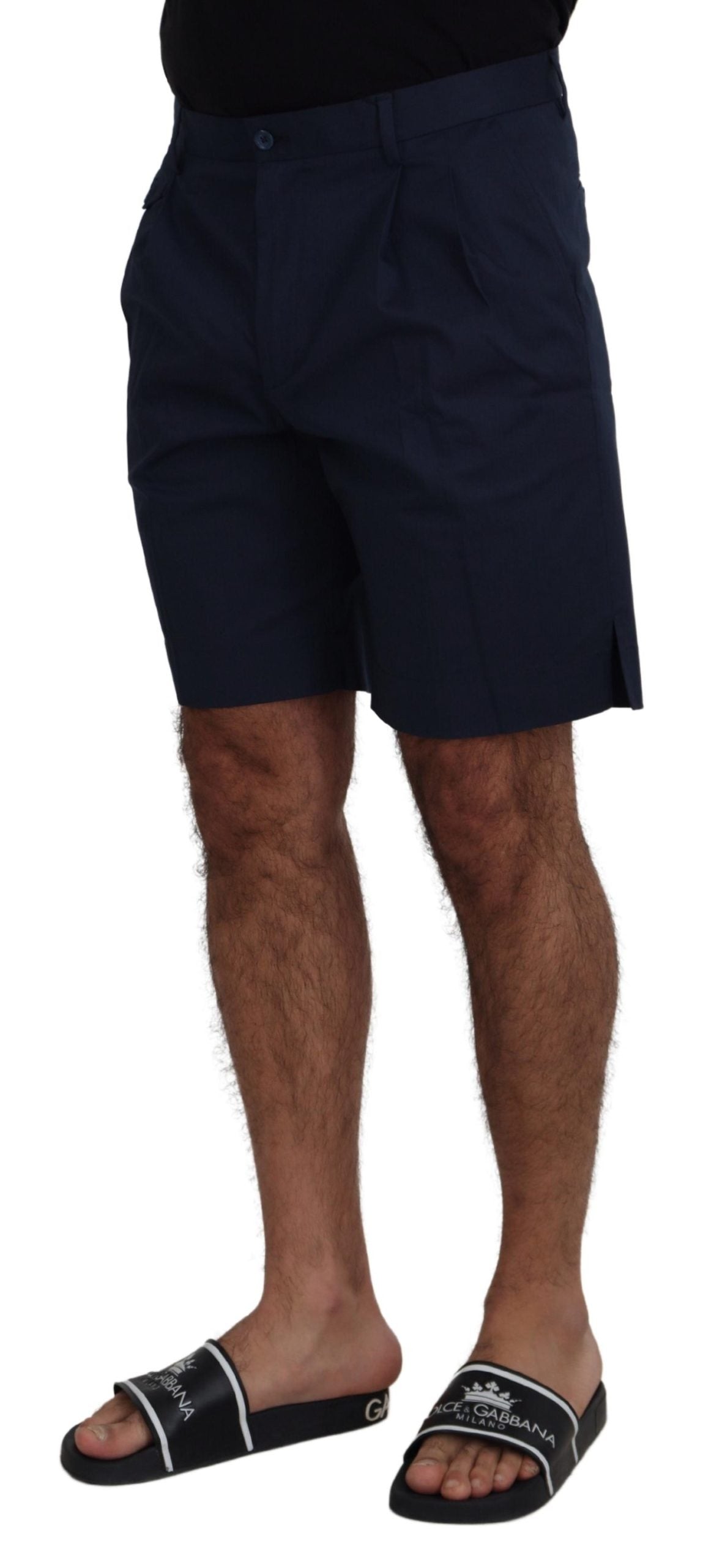 Man wearing black shorts and sandals