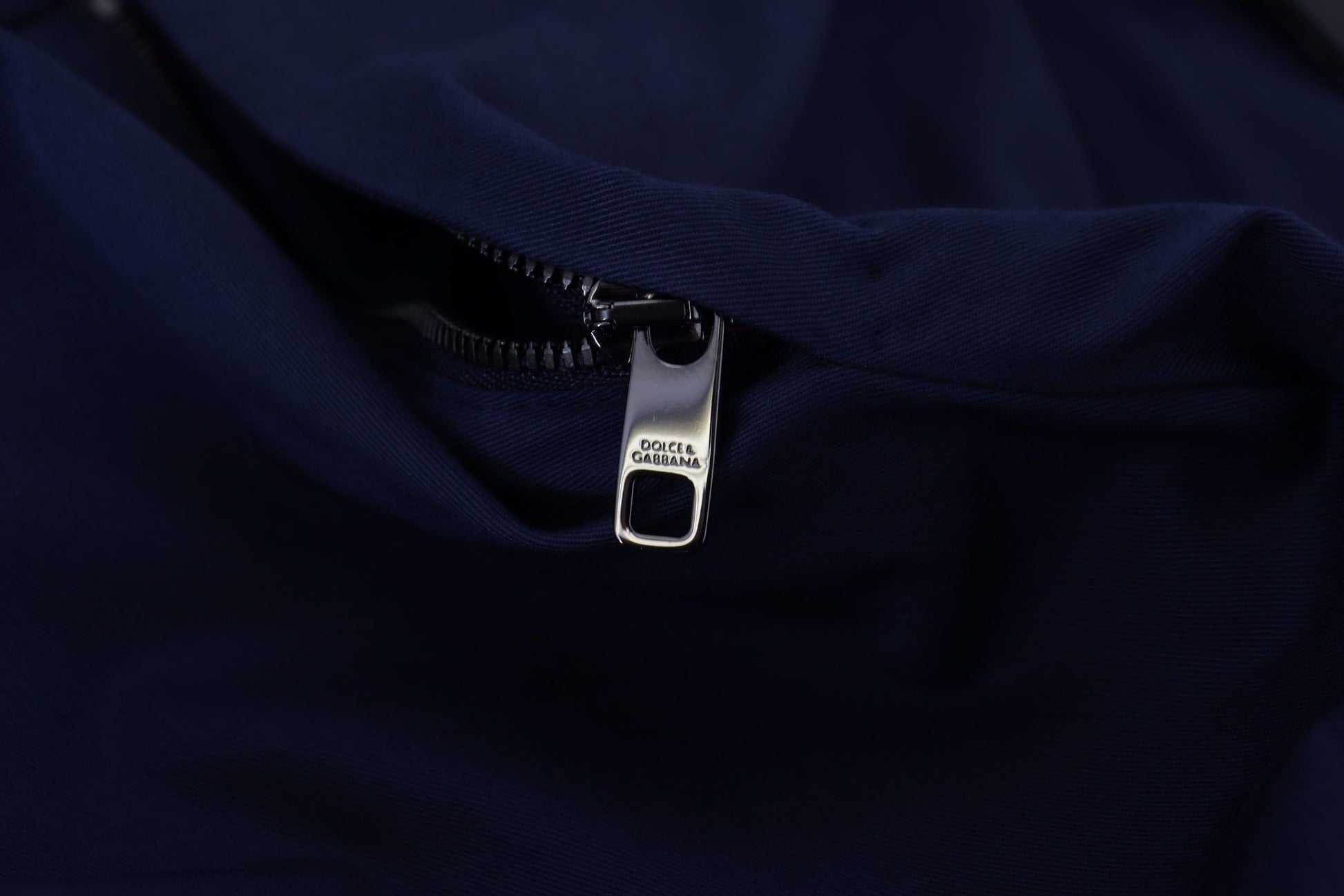Zipper on front of dark blue shirt