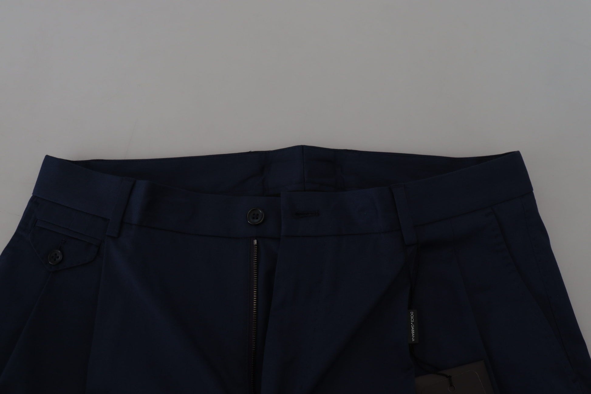 Pair of navy blue trousers with zippered pockets