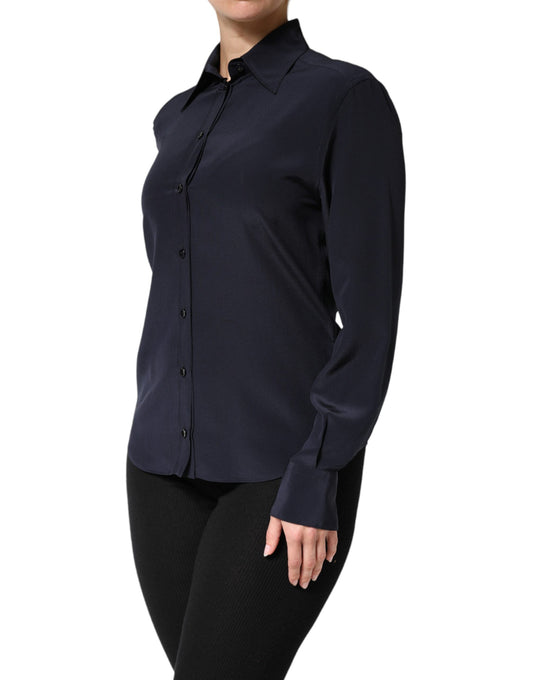 A long sleeve blue collared dress shirt top