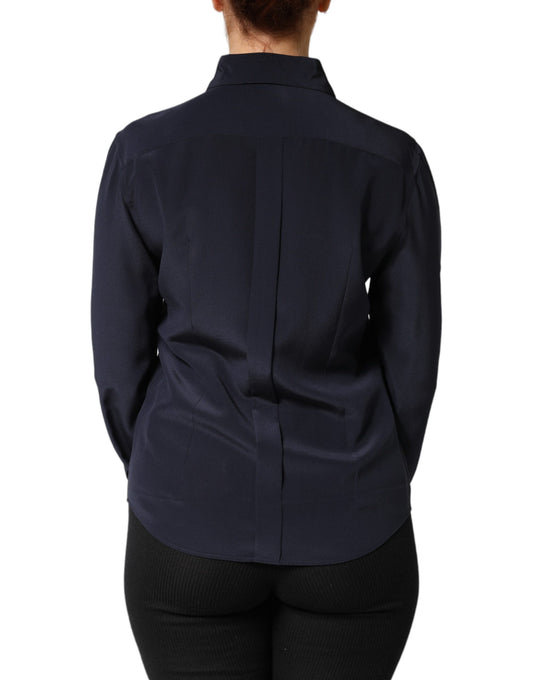 A long sleeve blue dress shirt with collar, worn by a mannequin