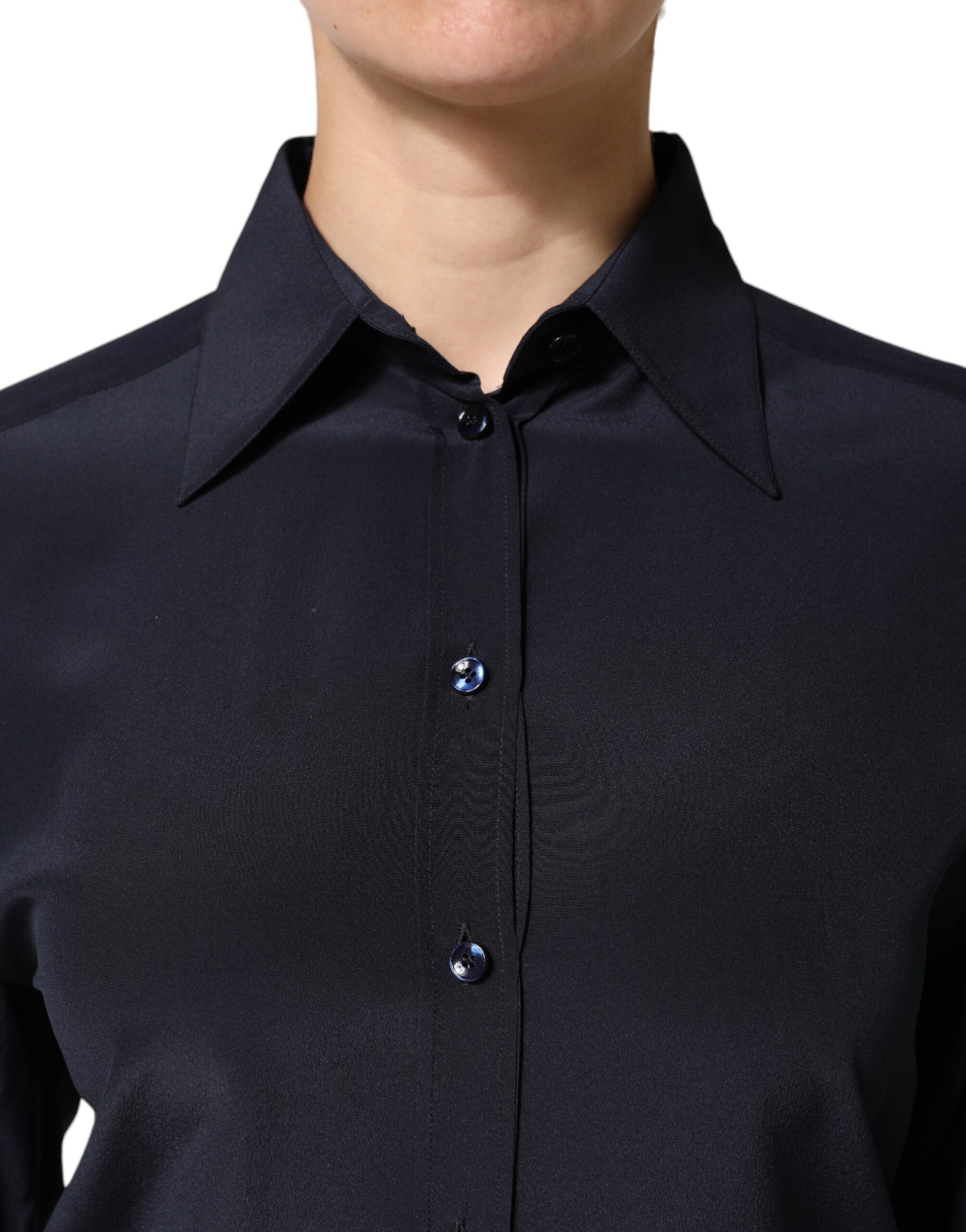 A blue collared long sleeve dress shirt top