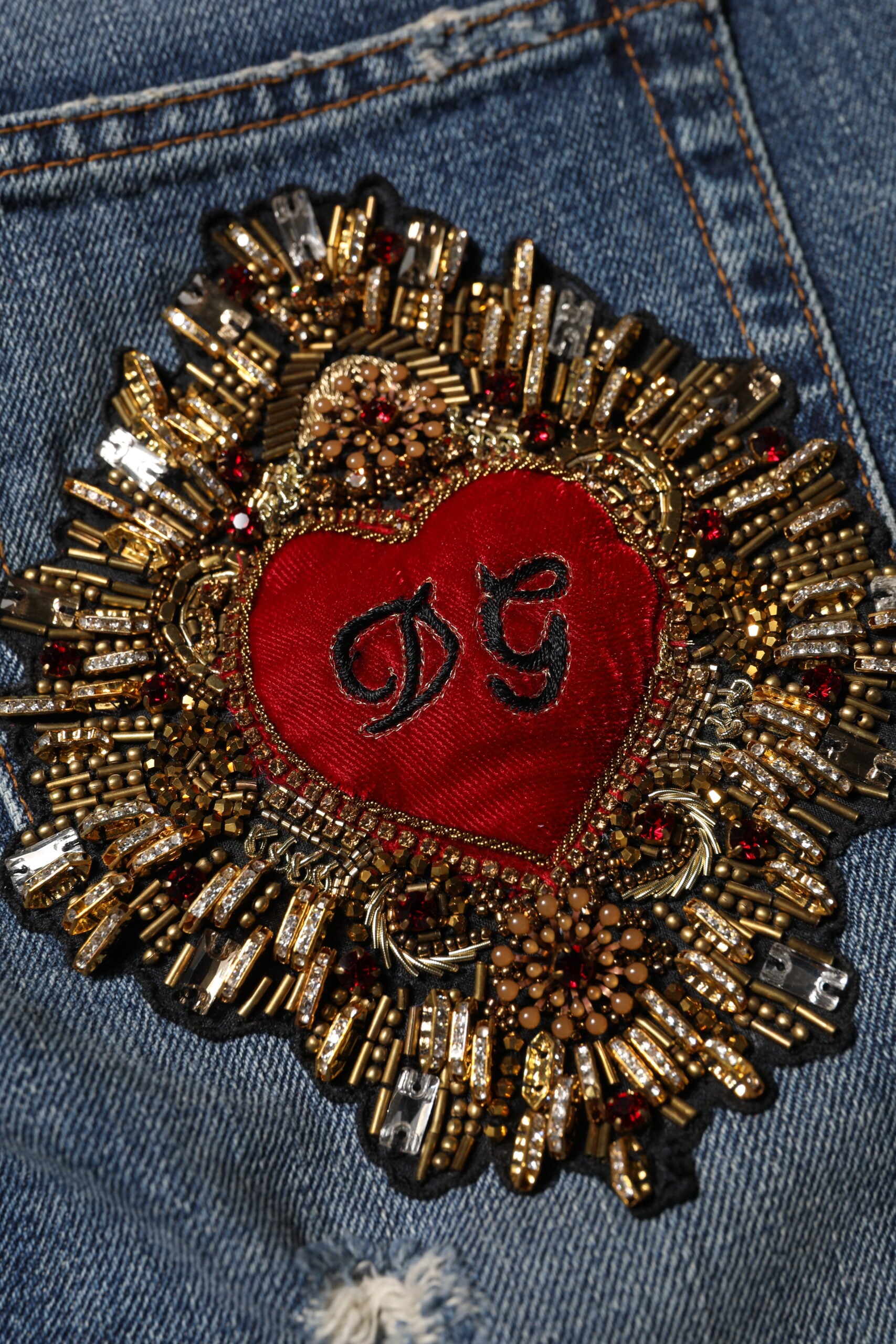 Decorative heart brooch on jeans