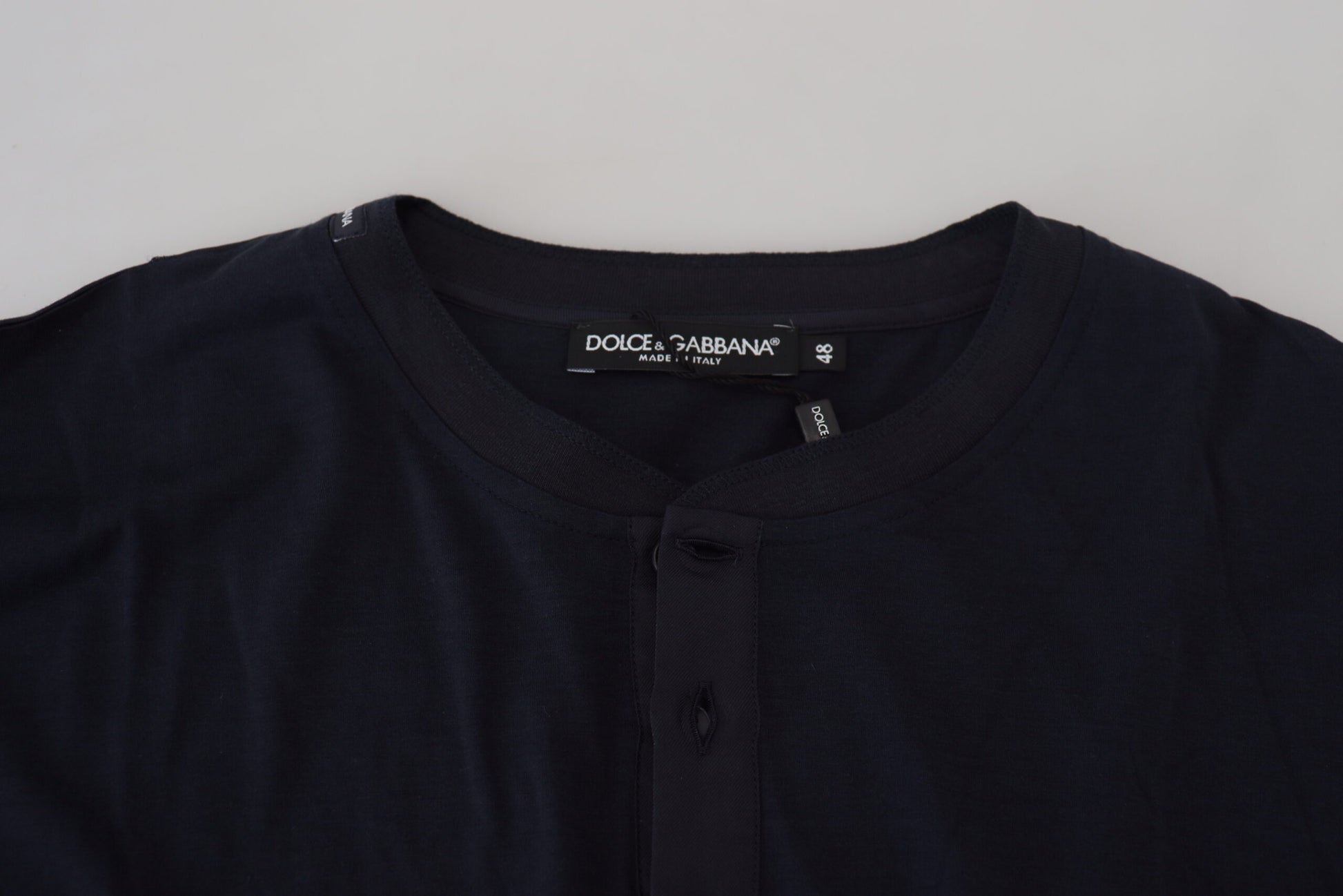Black long sleeve shirt on hanger