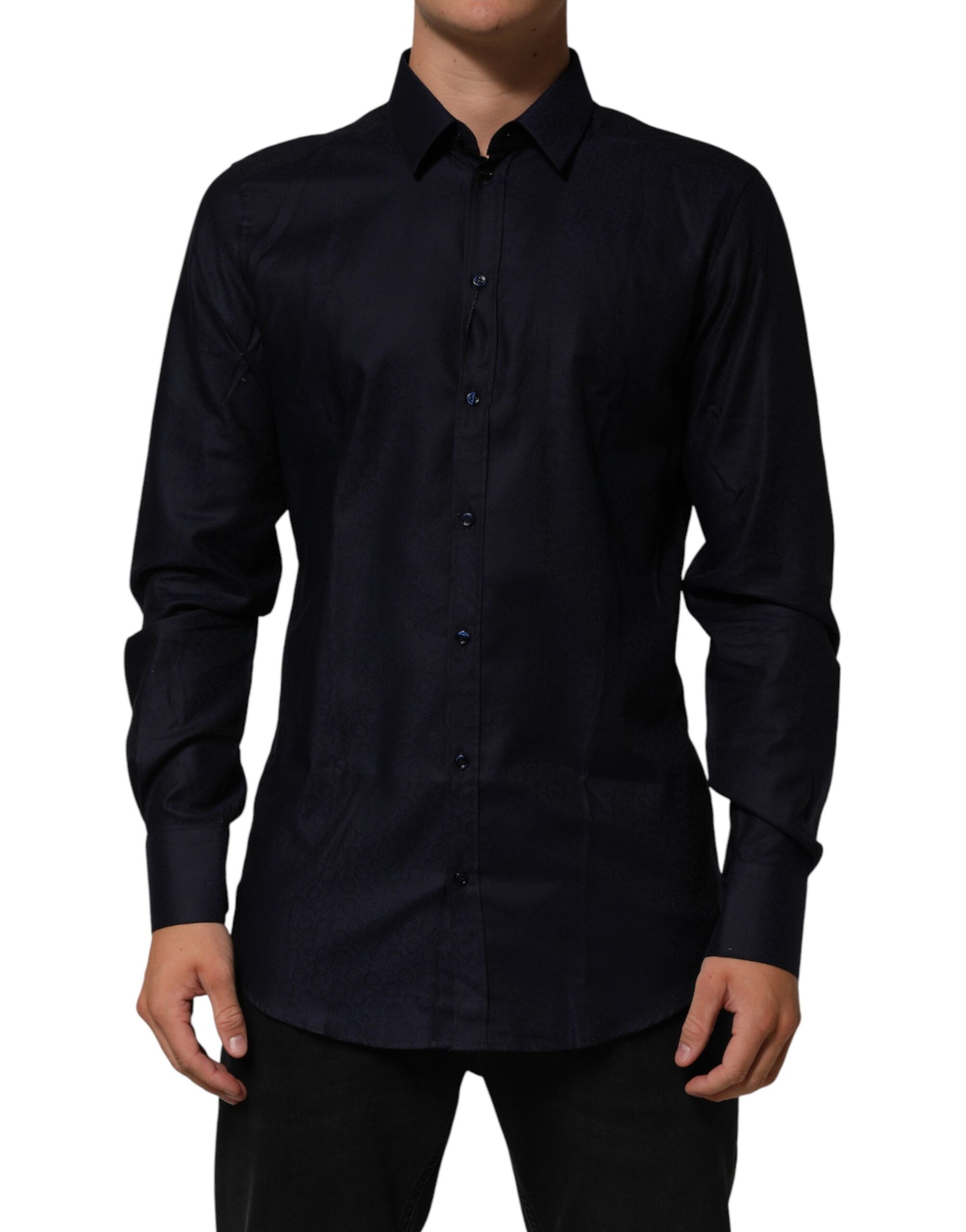 A long sleeved blue collared dress shirt with gold buttons