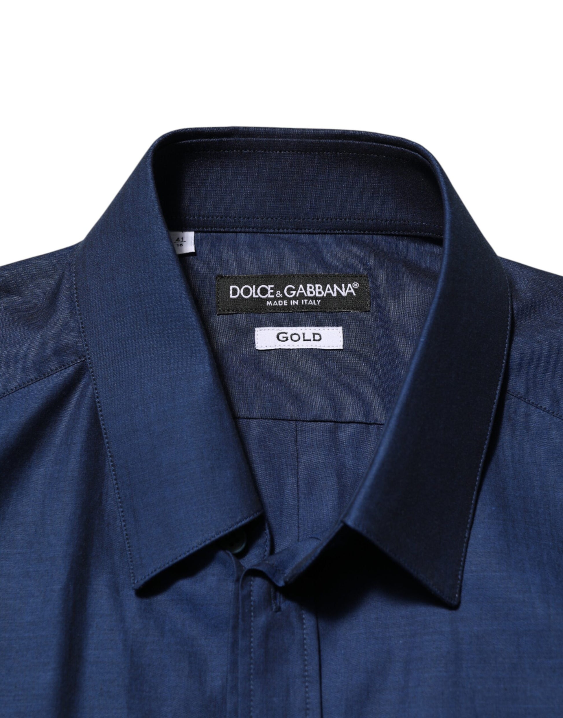 A blue cotton collared men's dress shirt with a gold label