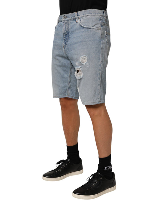 Man wearing denim shorts and black shoes