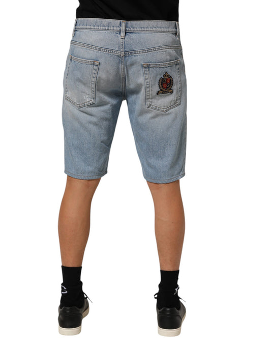 Pair of blue denim shorts with embroidered logo on right leg