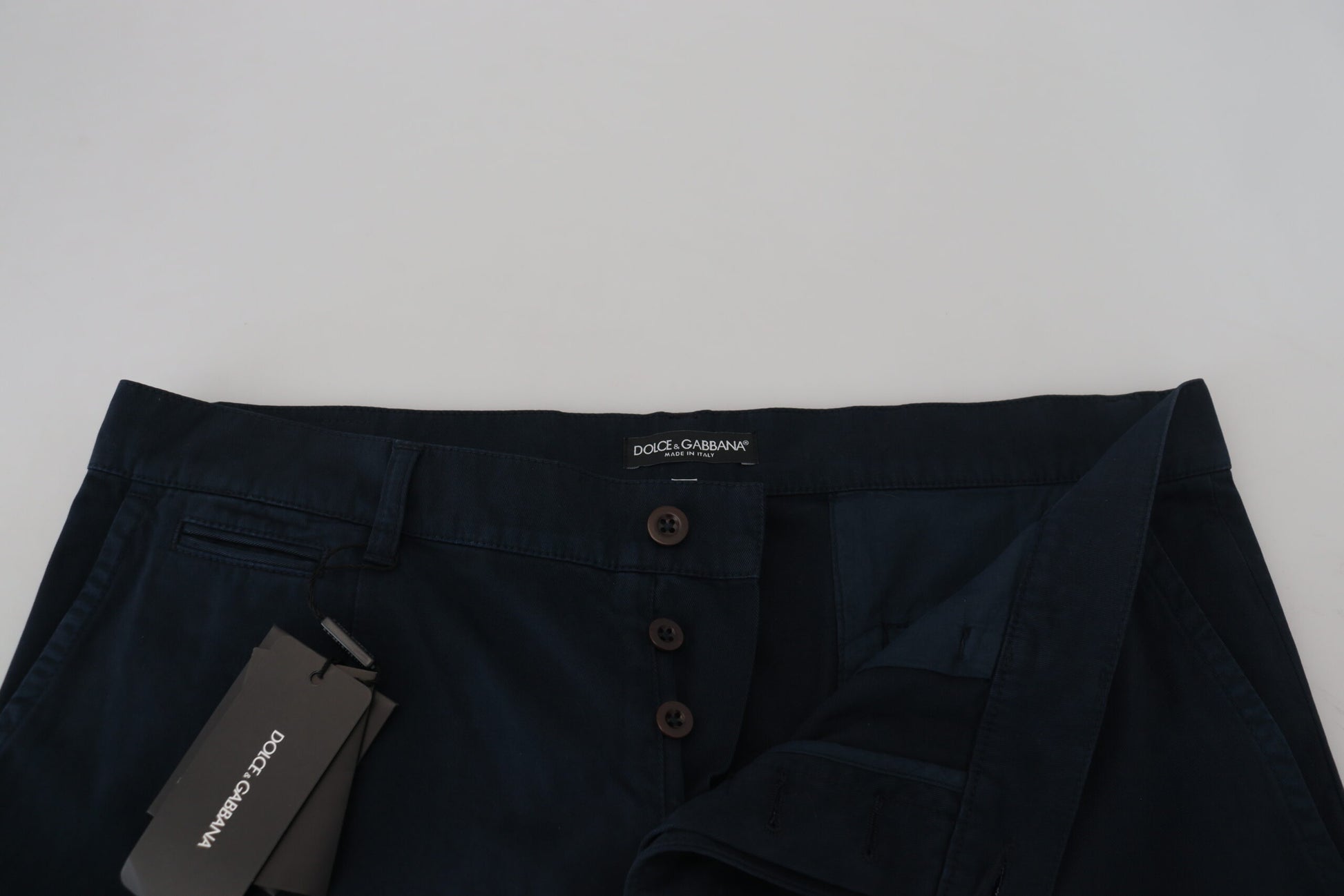 A pair of men's formal trousers by Dolce & Gabbana, featuring a blue cotton fabric and visible brand label
