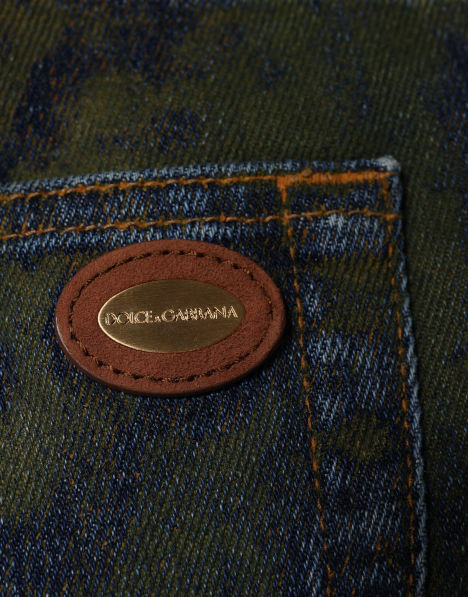 Denim jeans with a red leather patch on the back pocket