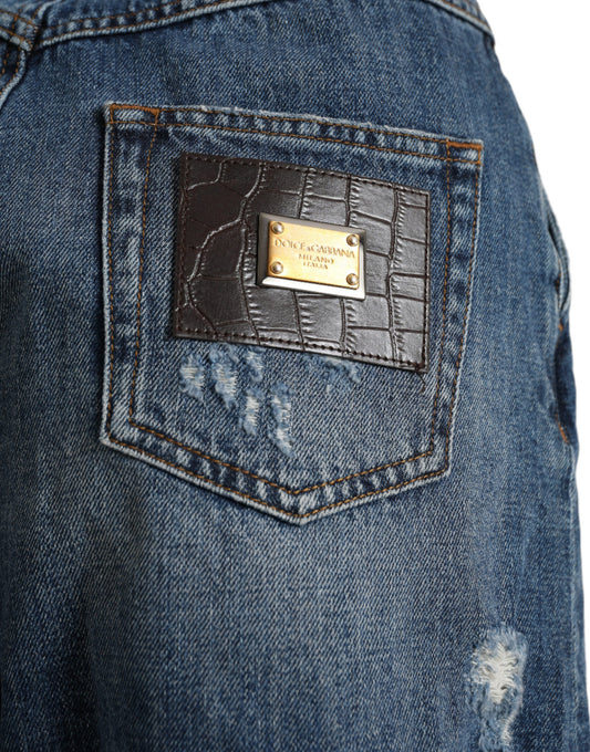 Blue denim jeans with a brown leather patch on the front pocket