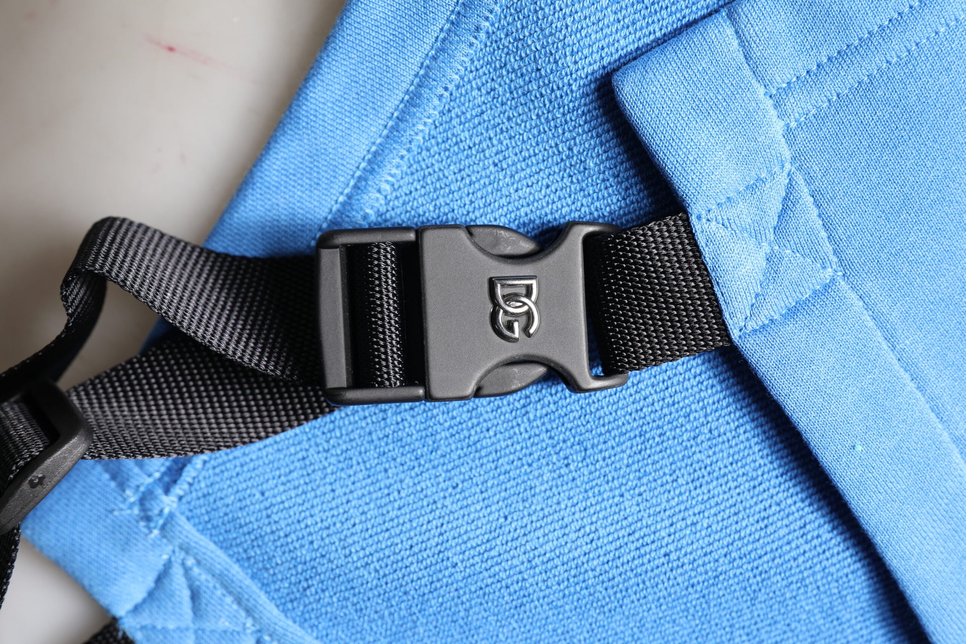 Blue jacket with black straps