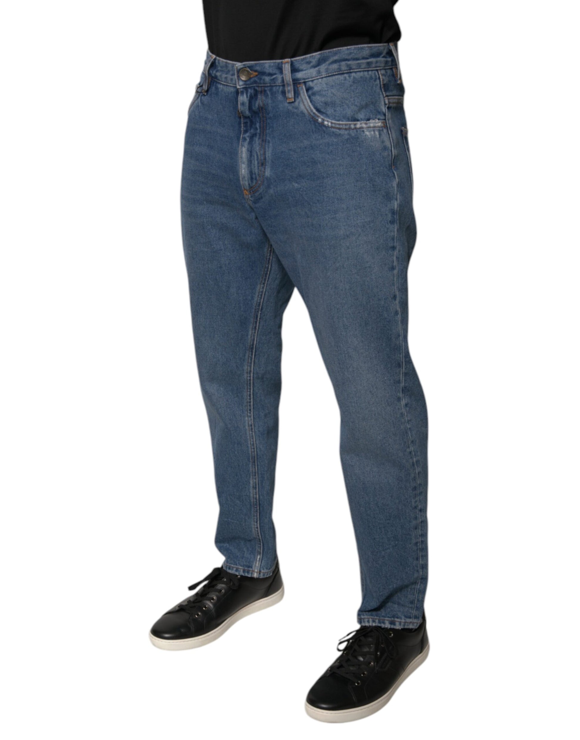 Man wearing blue jeans and black shoes