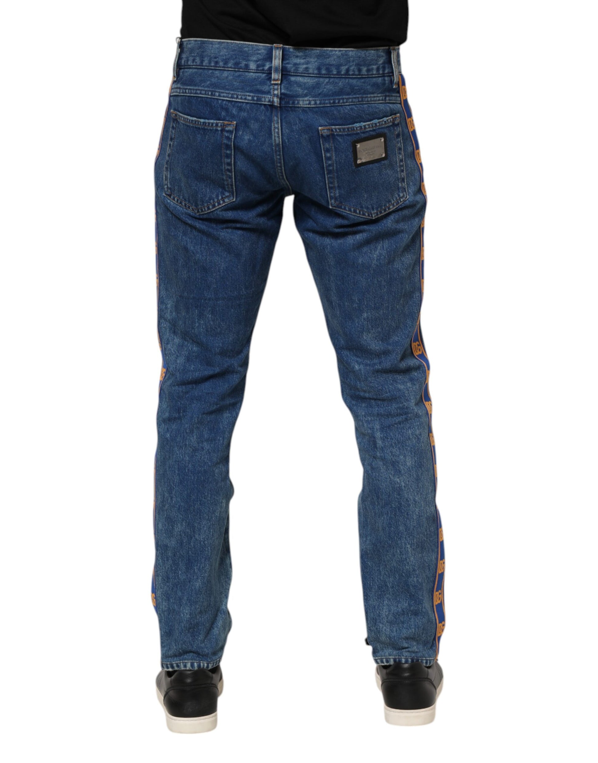 Pair of blue jeans with orange stitching on back pockets